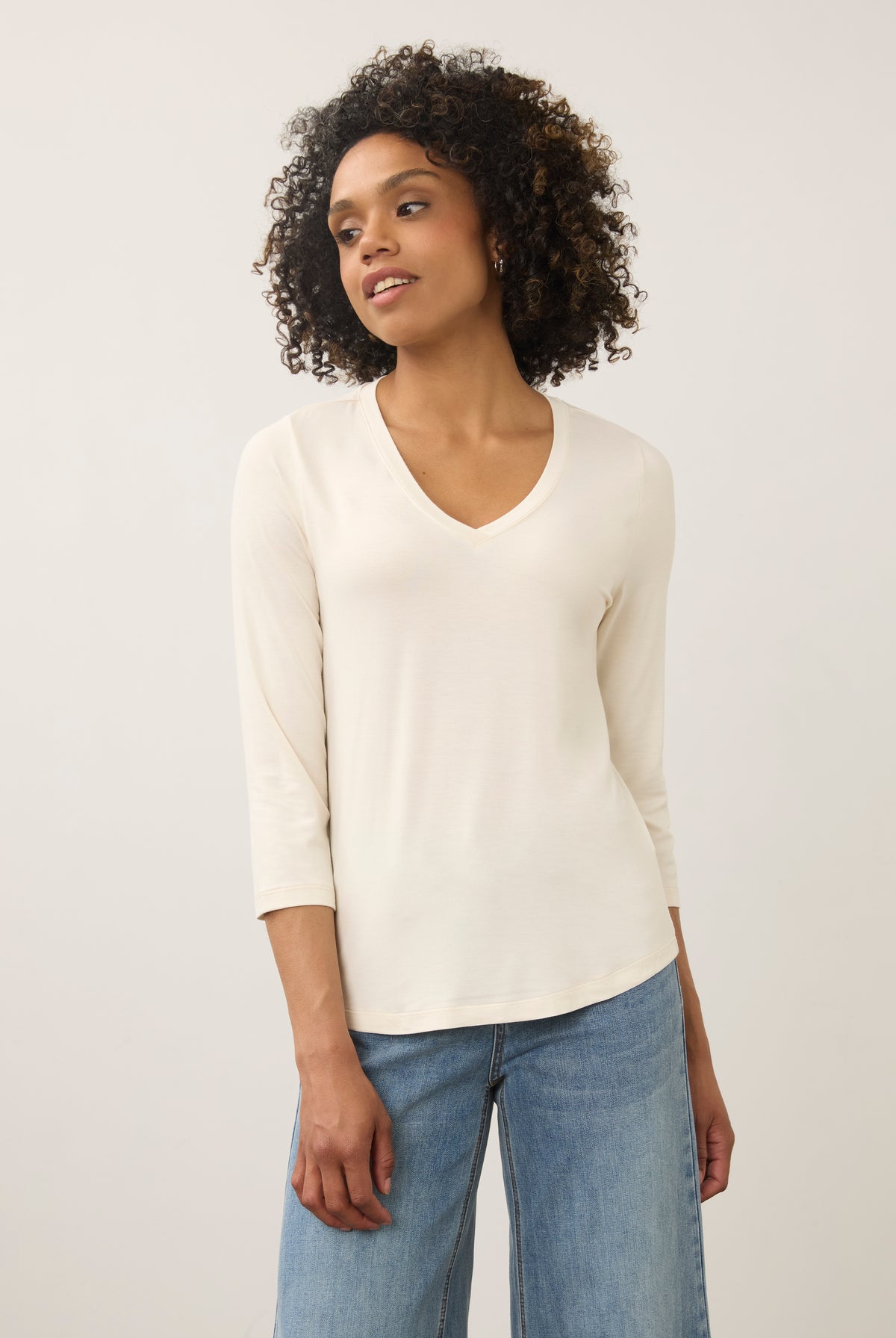 Front view of cream 3/4 sleeve V-neck top showcasing soft fabric and classic fit by French Dressing Jeans (FDJ)