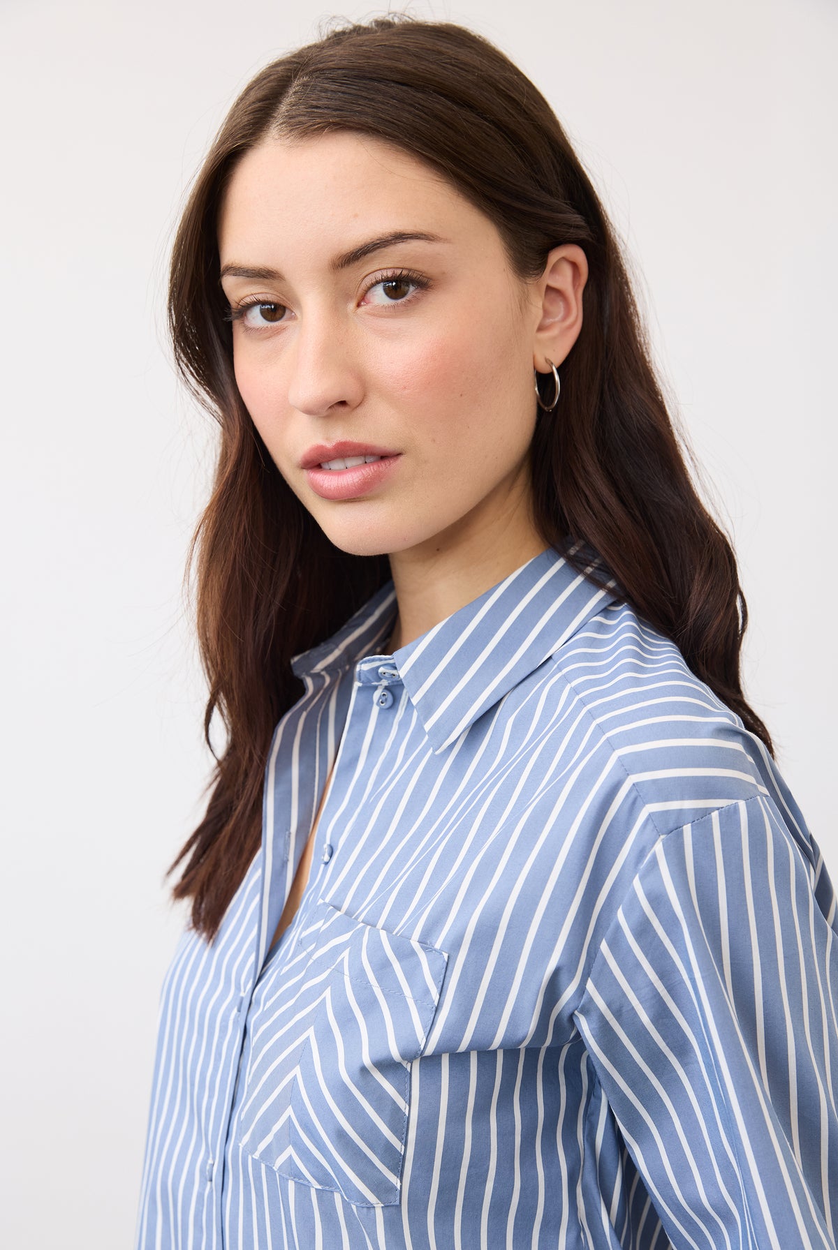 Close-up of blue striped shirt showcasing collar and button details by French Dressing Jeans (FDJ)