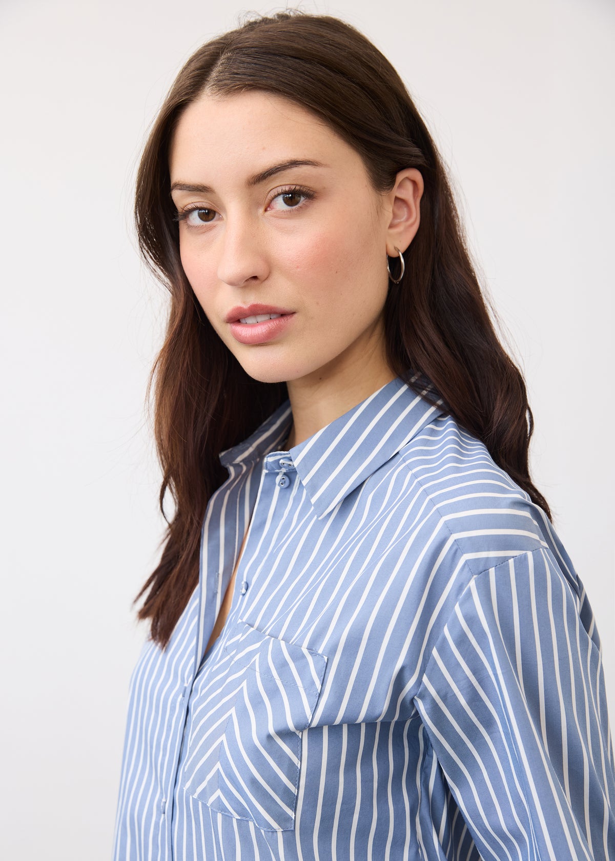 Close-up of blue striped shirt showcasing collar and button details by French Dressing Jeans (FDJ)