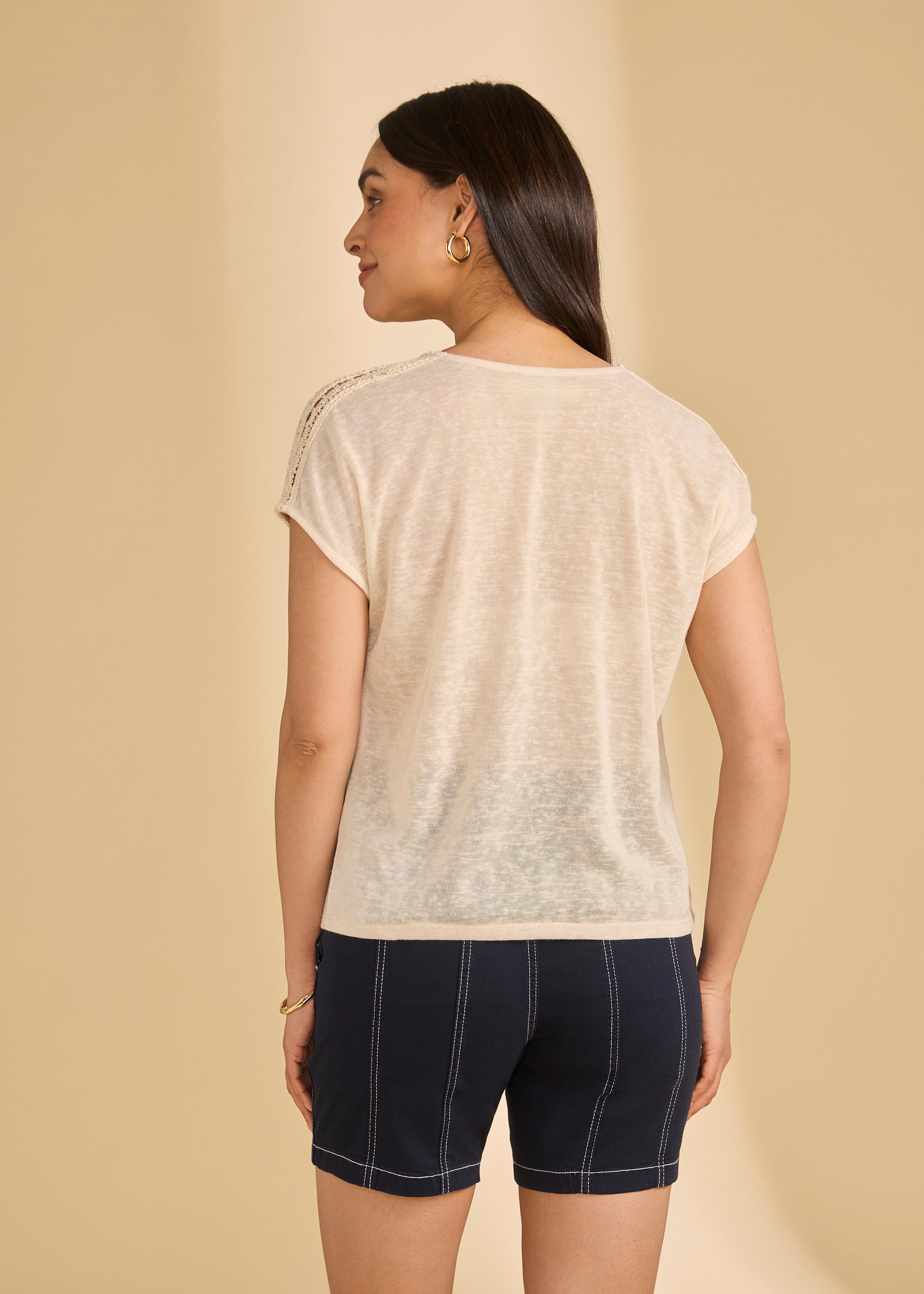 Back view of beige V-neck top showcasing crochet shoulder design by French Dressing Jeans (FDJ)