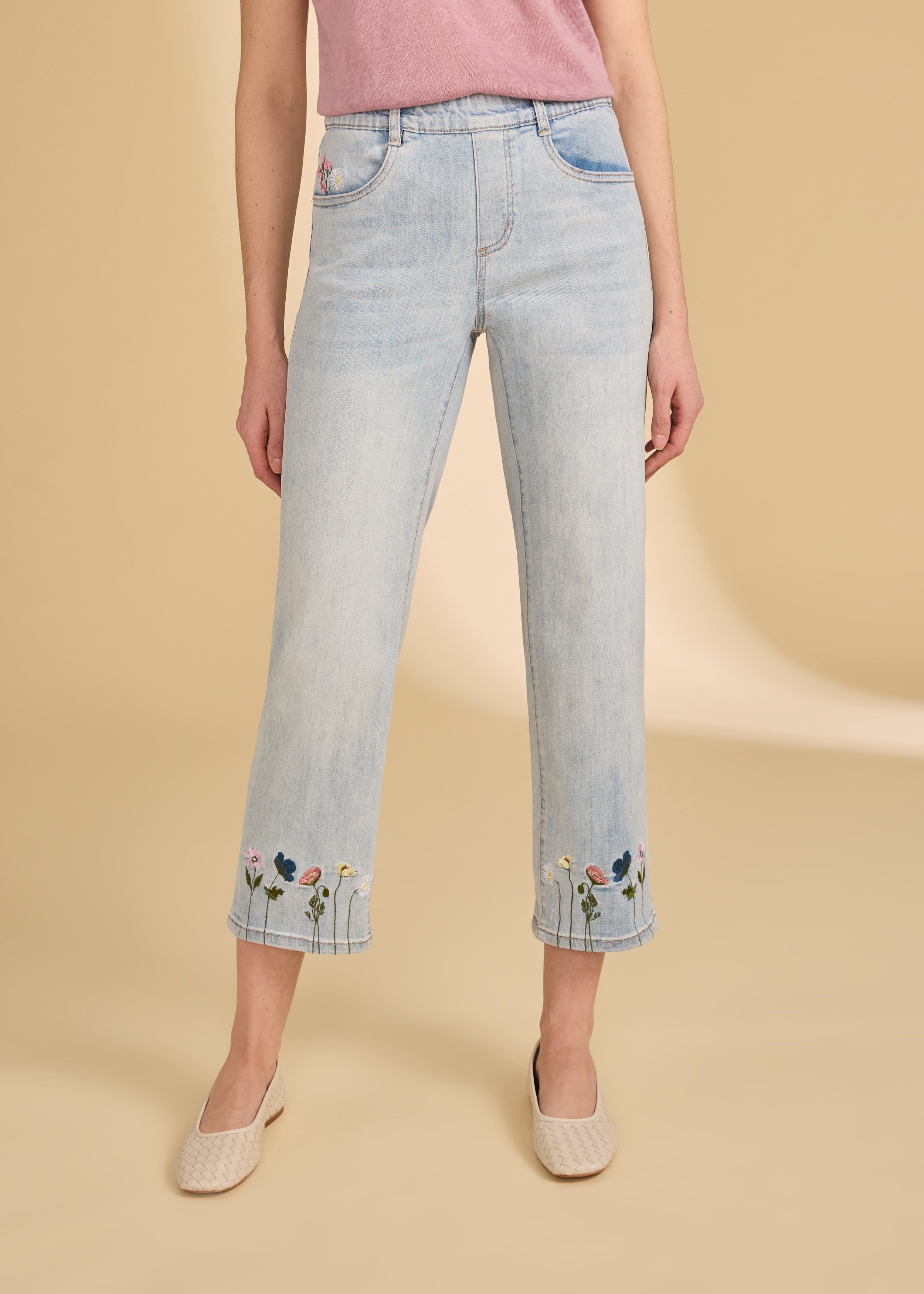 Front view of light medium pull-on wide ankle denim with floral embroidery and pink tee by French Dressing Jeans (FDJ)