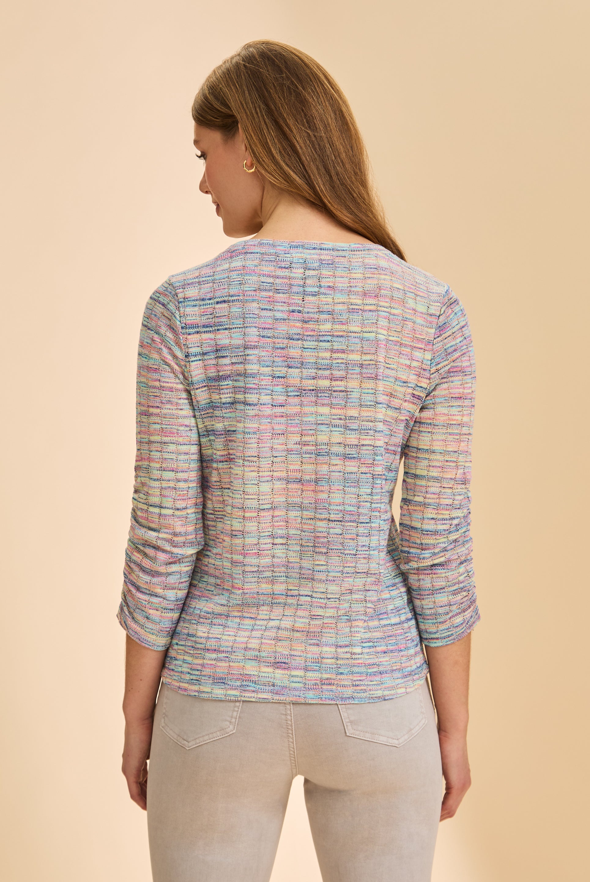 Back view of pastel multicolor V-neck sweater showing textured pattern by French Dressing Jeans (FDJ)