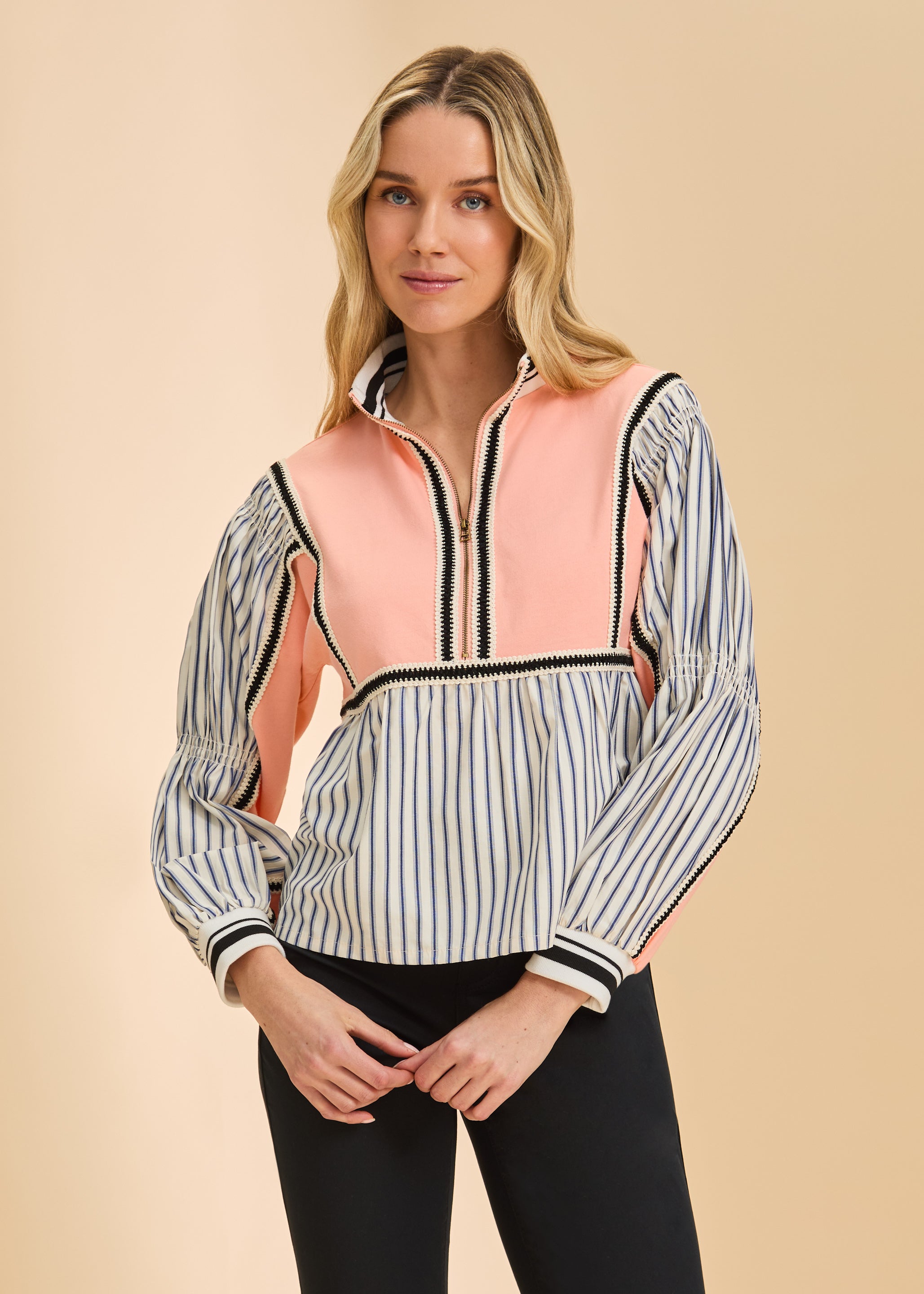 Front view of cantaloupe mix media half zip top with striped sleeves and high collar by French Dressing Jeans (FDJ)