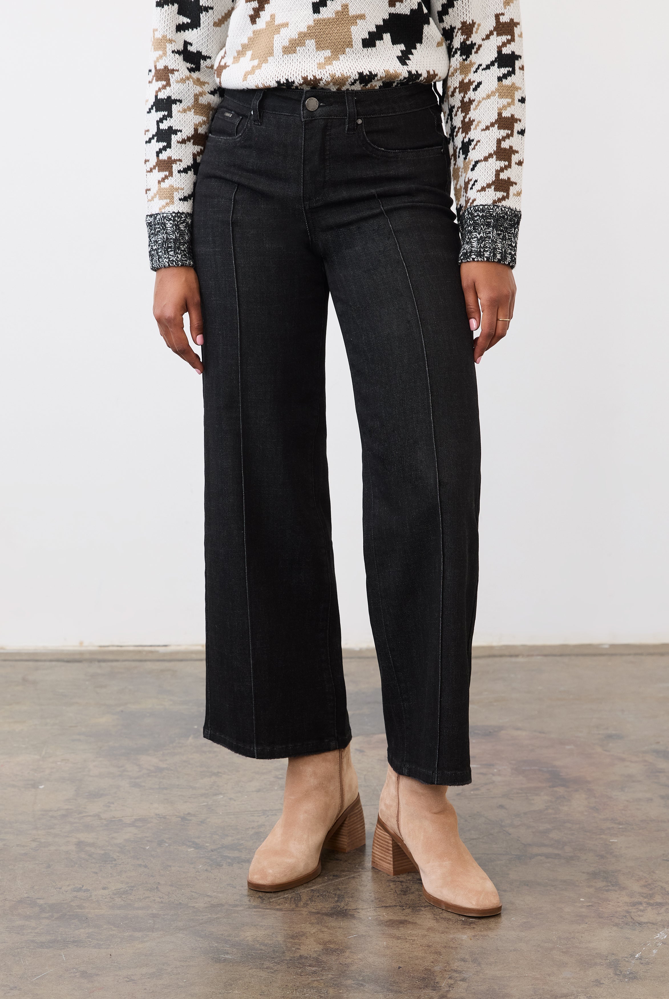 Front view of black wide-leg denim showing pintuck seams and mid-rise waist by French Dressing Jeans (FDJ)