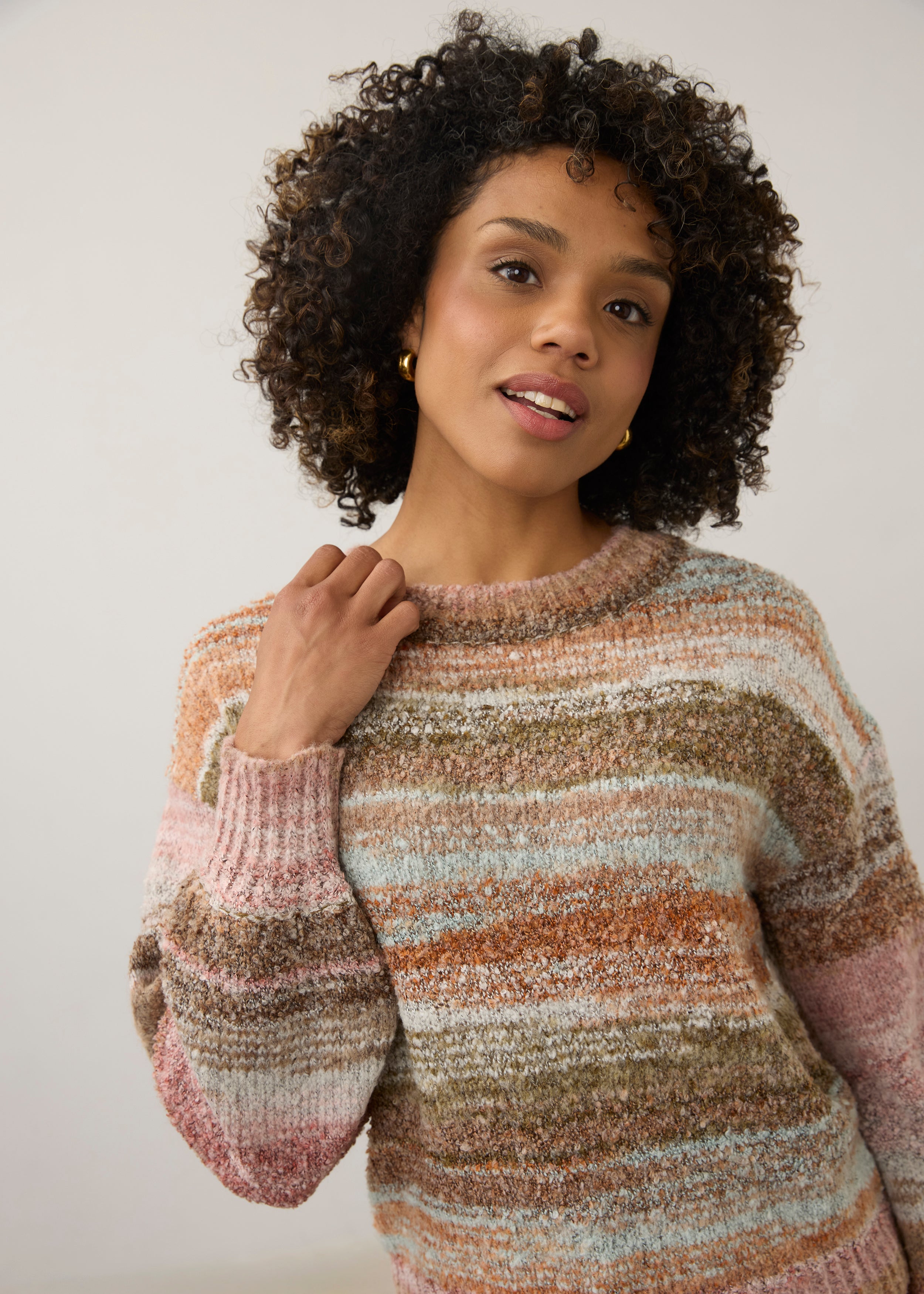 Detail shot of natural spacedye boucle sweater focusing on boat neckline by French Dressing Jeans (FDJ)