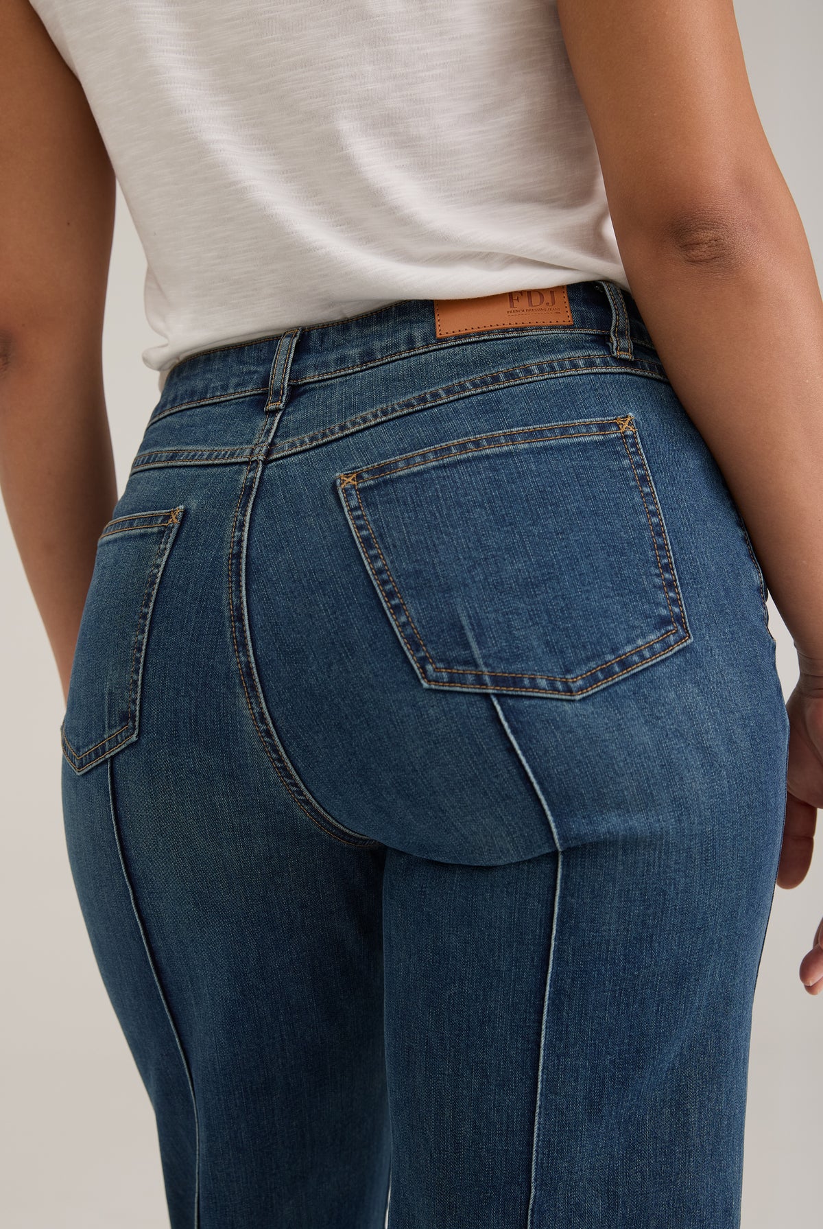 Detail shot of back pockets and waistline on dark wash Olivia denim by French Dressing Jeans (FDJ)