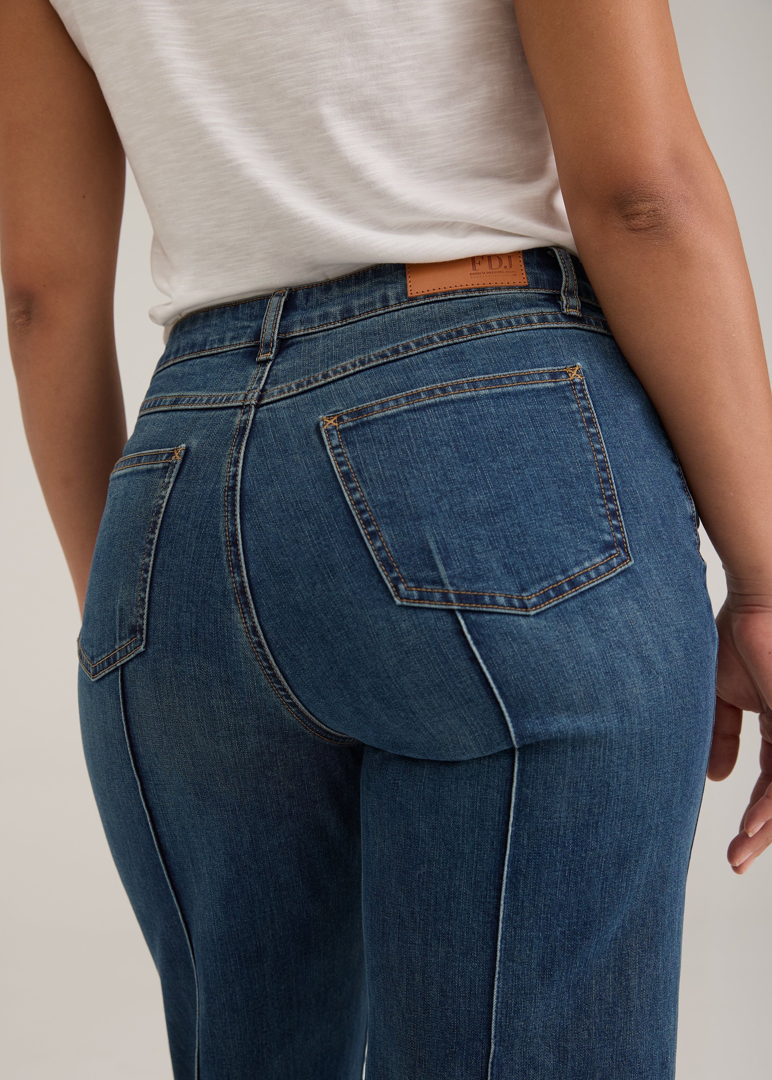 Detail shot of back pockets and waistline on dark wash Olivia denim by French Dressing Jeans (FDJ)