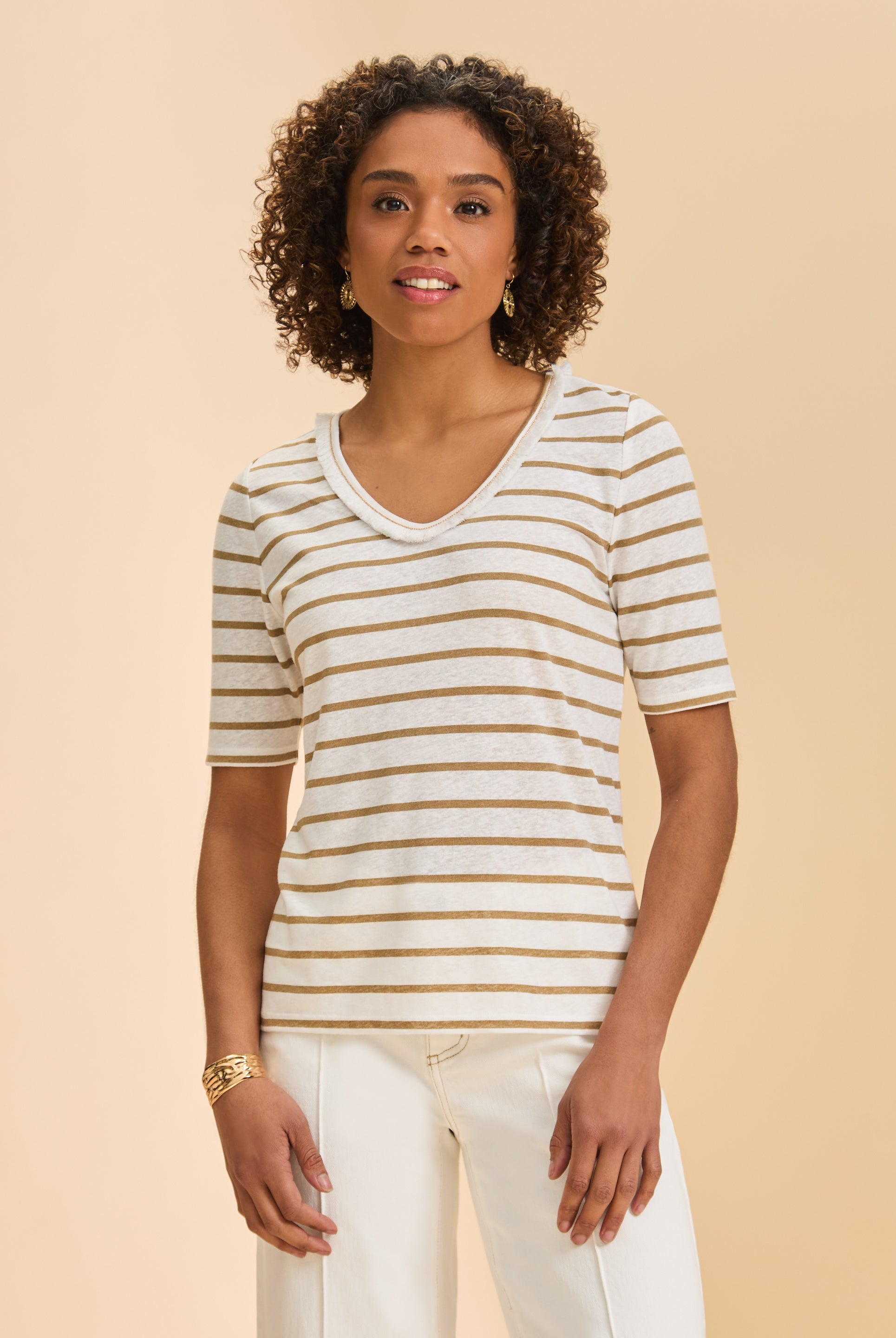 Front view of beige striped V-neck short sleeve top paired with white pants by French Dressing Jeans (FDJ)
