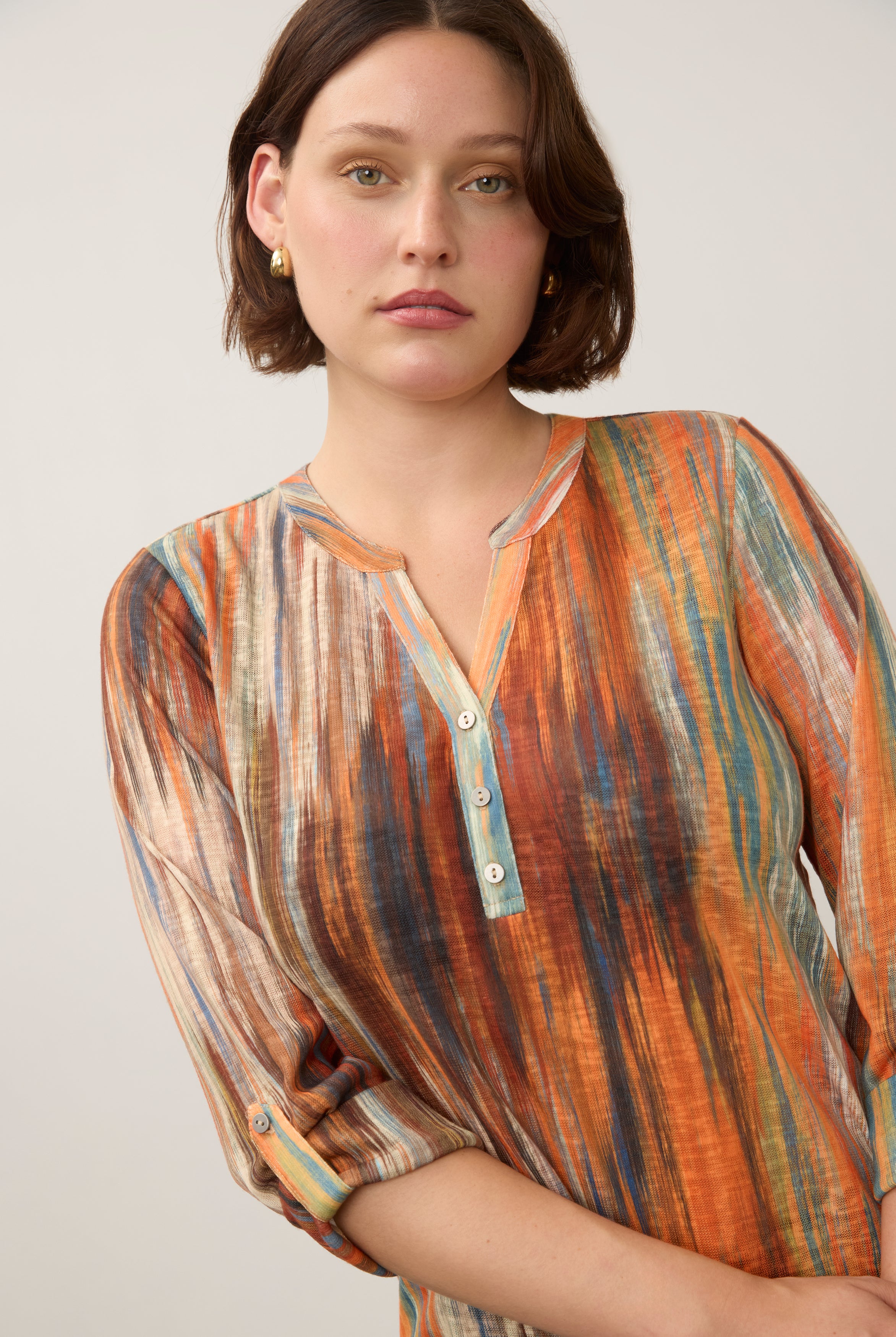 Close-up of Heat Henley top featuring button-front detail and colorful pattern by French Dressing Jeans (FDJ)