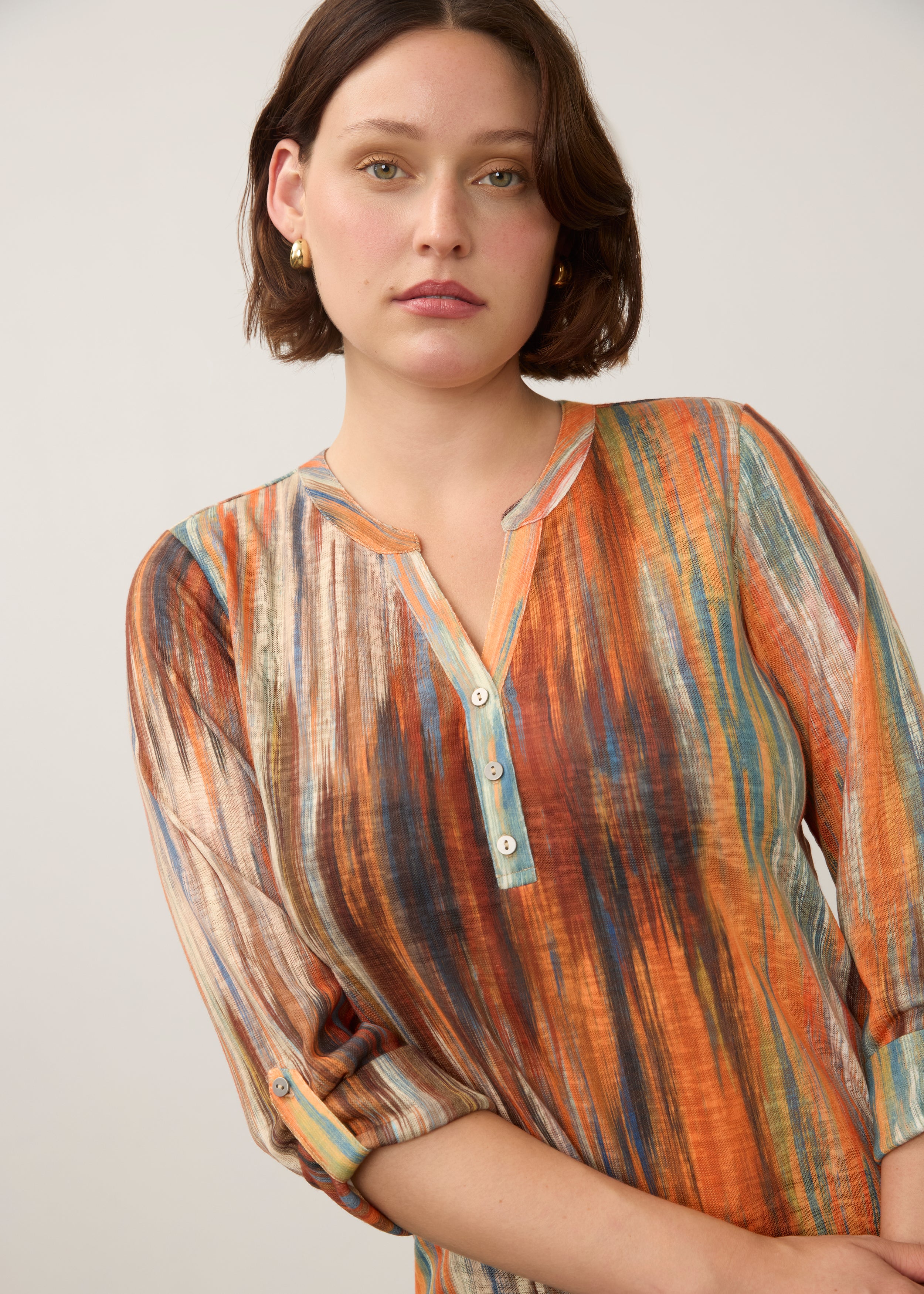 Close-up of Heat Henley top featuring button-front detail and colorful pattern by French Dressing Jeans (FDJ)