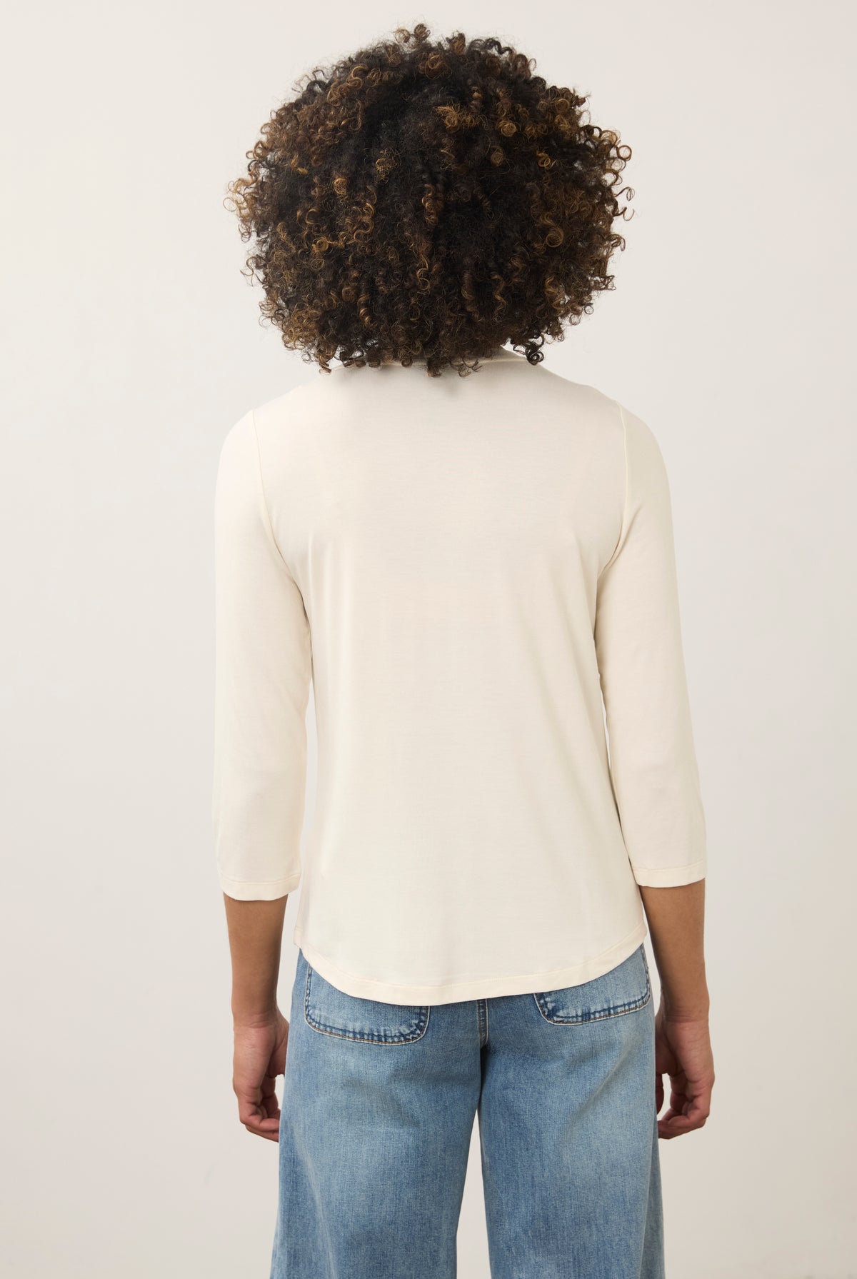 Back view of cream V-neck top highlighting seamless design and smooth material by French Dressing Jeans (FDJ)
