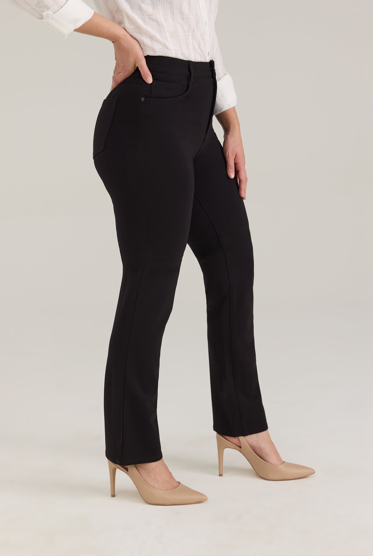 Side view of black pants showing leg silhouette and front pockets by French Dressing Jeans (FDJ)