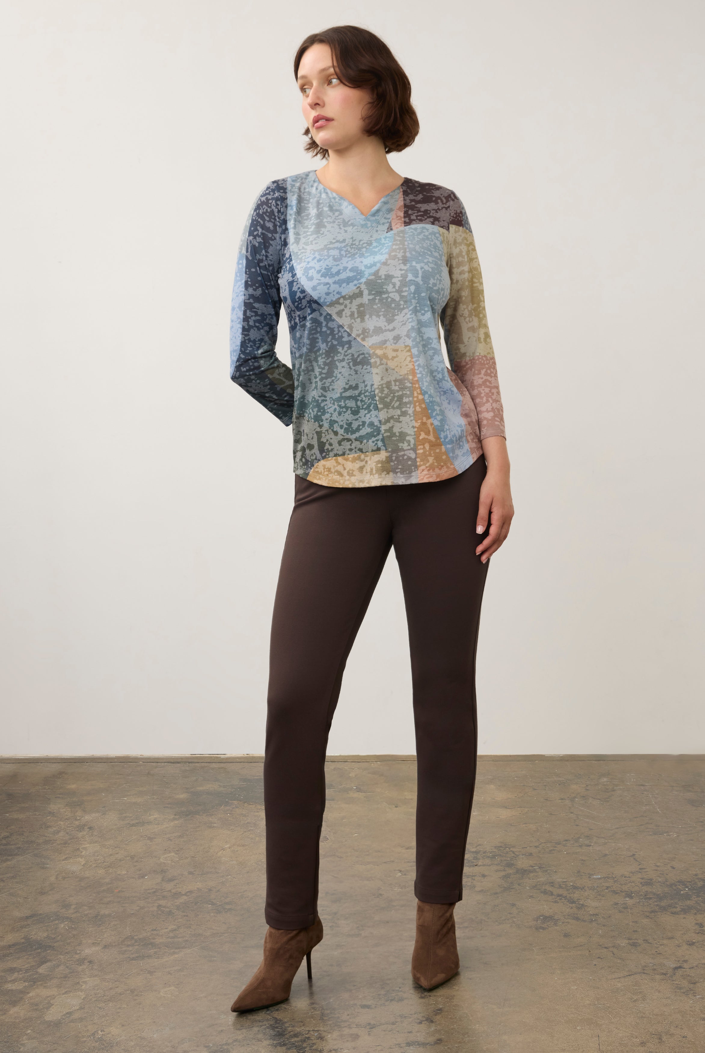 Full-body view of 3/4 sleeve notch neck top paired with brown pants in Warn color by French Dressing Jeans (FDJ)