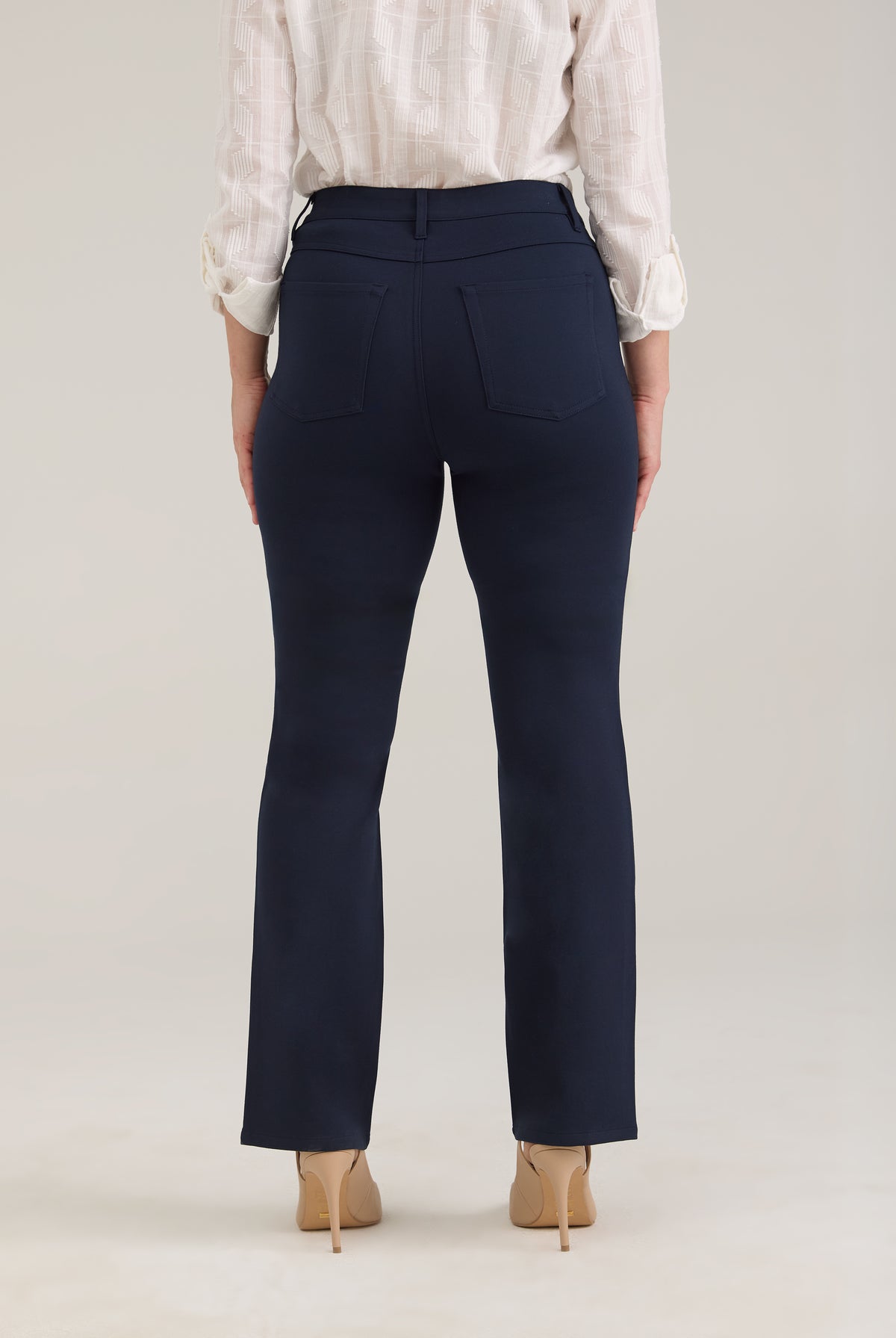 Back view of navy pants featuring patch pockets by French Dressing Jeans (FDJ)
