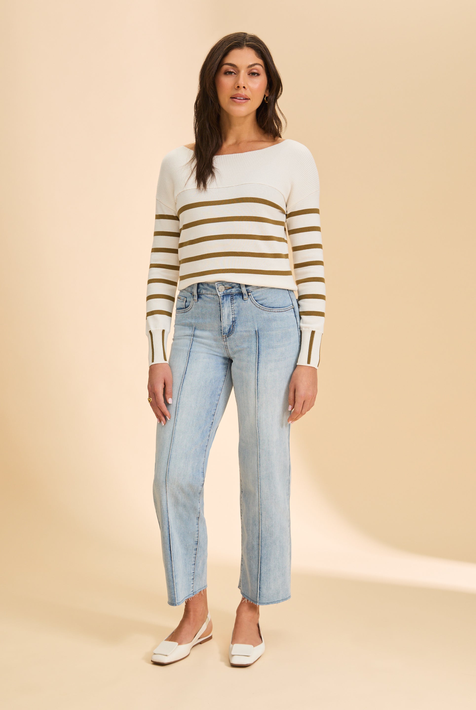 Full view of white/green stripe sweater paired with light blue jeans by French Dressing Jeans (FDJ)