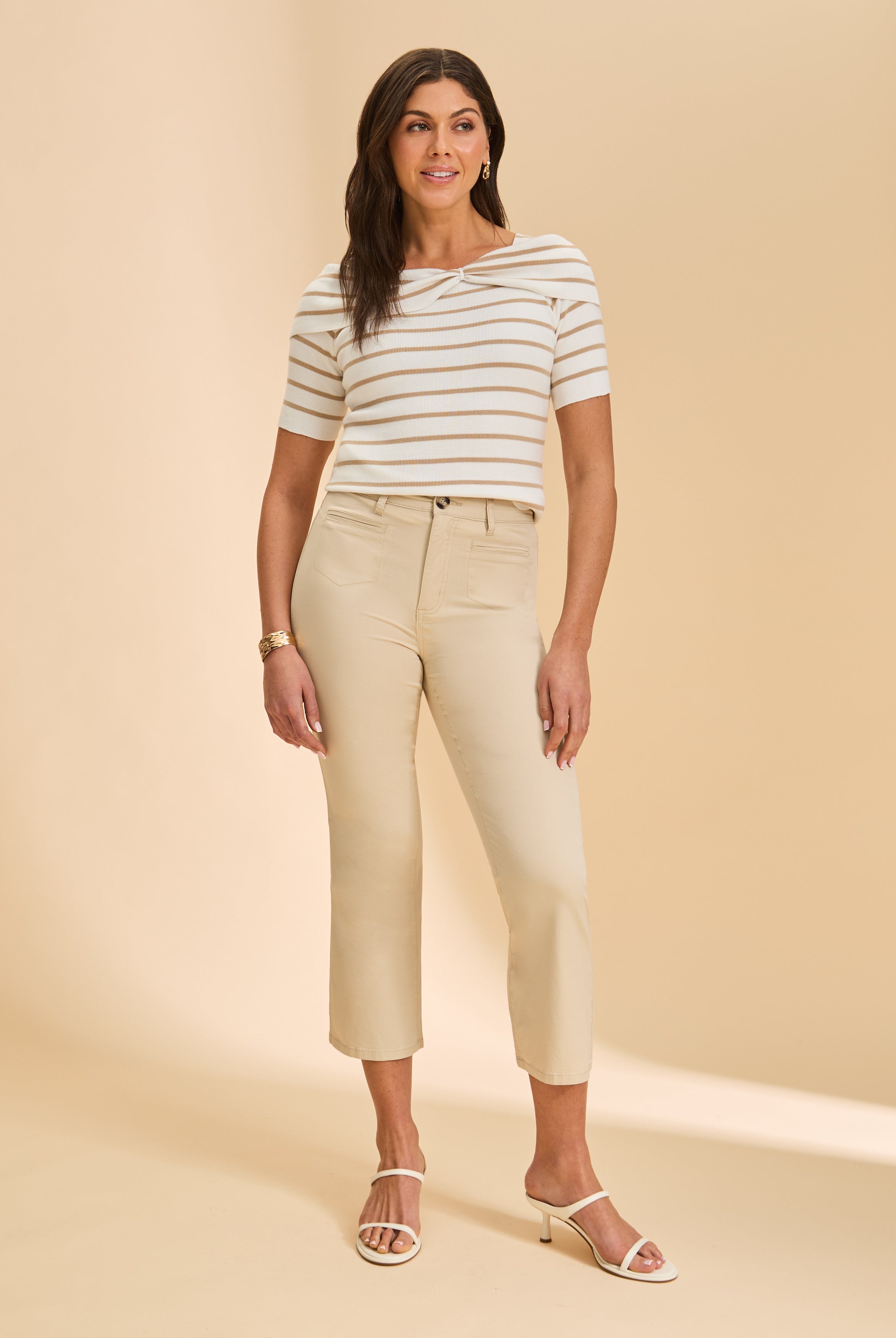 Full view of beige and white stripe sweater paired with light beige pants by French Dressing Jeans (FDJ)