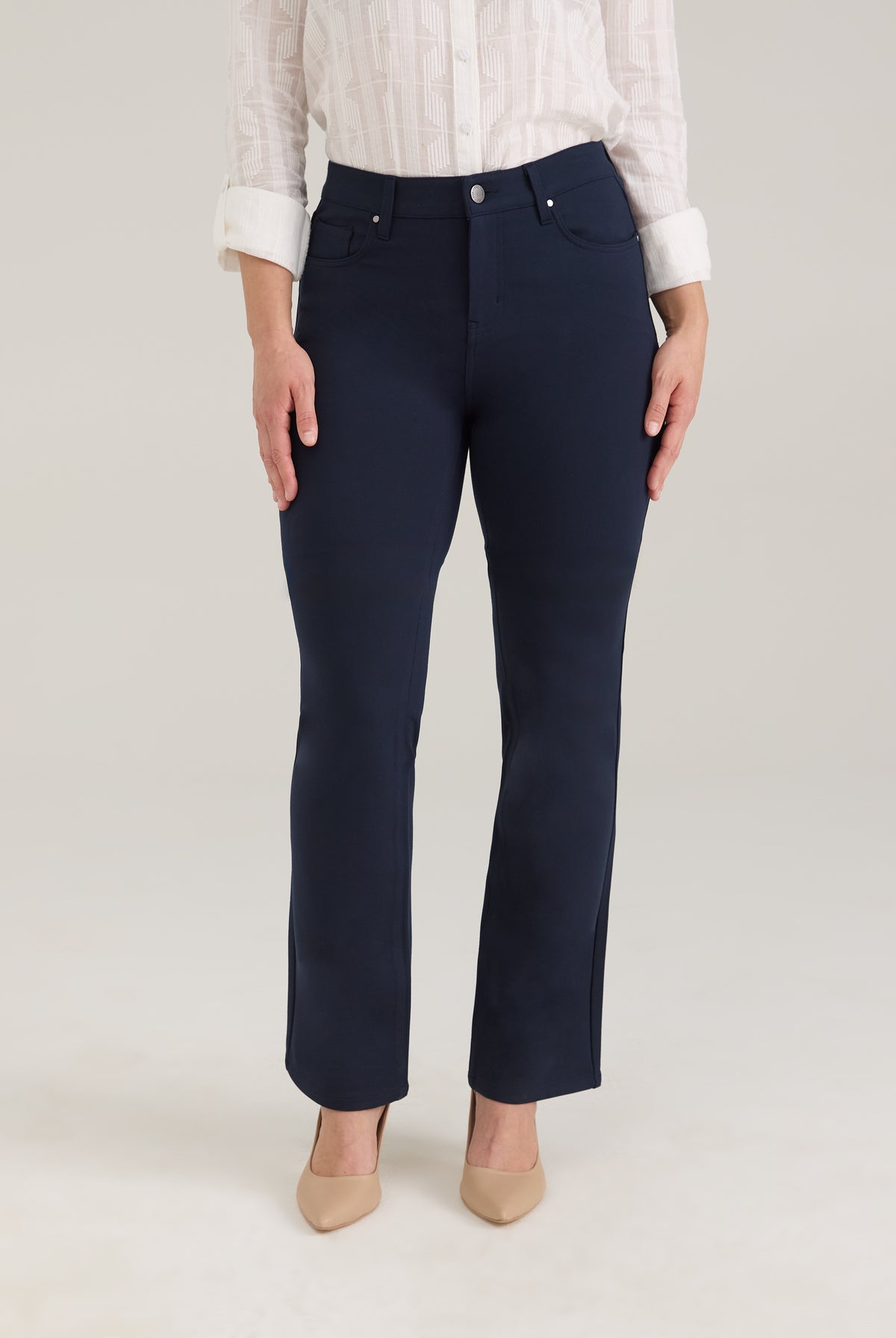 Front view of navy pants with button closure and front pockets by French Dressing Jeans (FDJ)