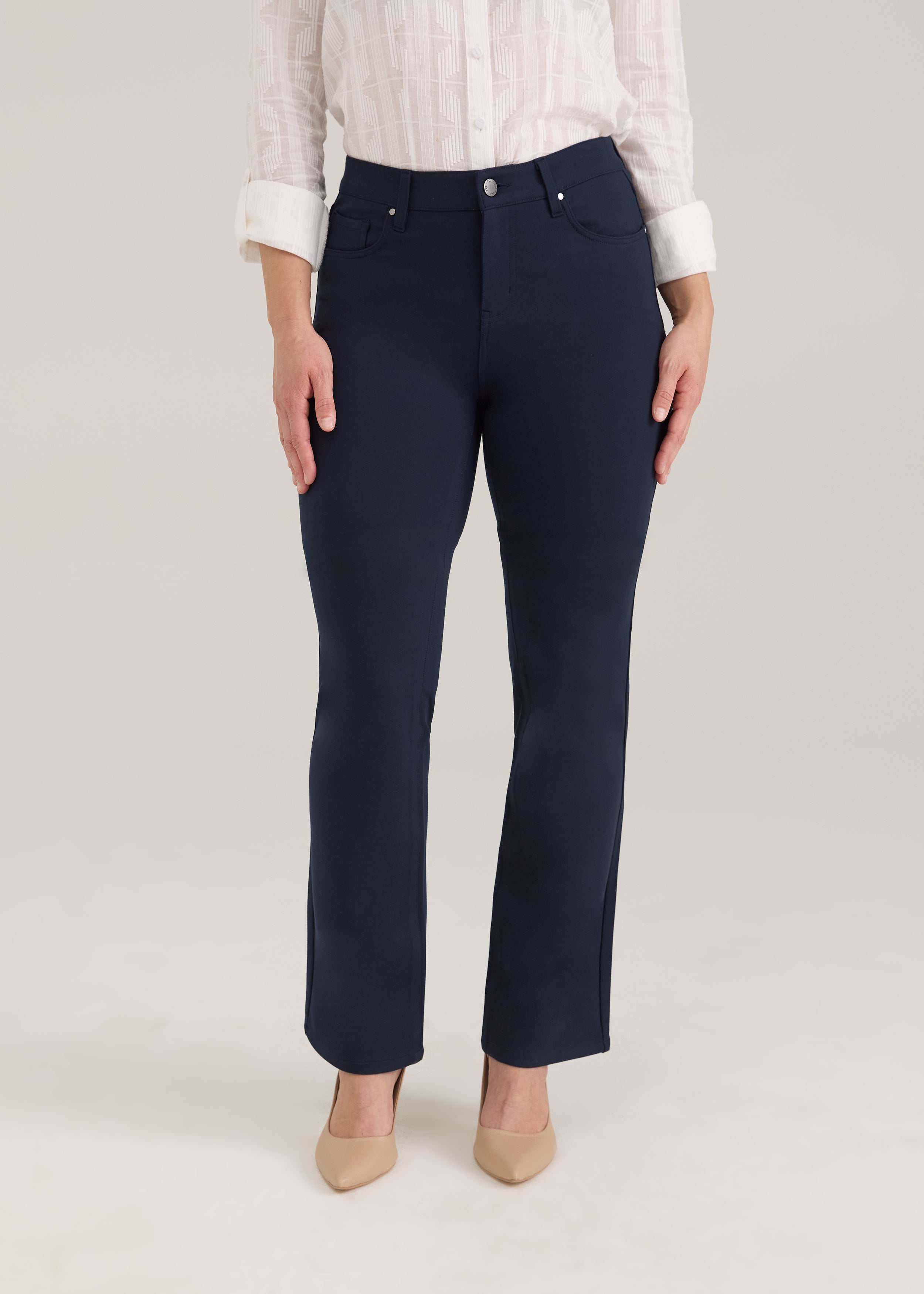 Front view of navy pants with button closure and front pockets by French Dressing Jeans (FDJ)