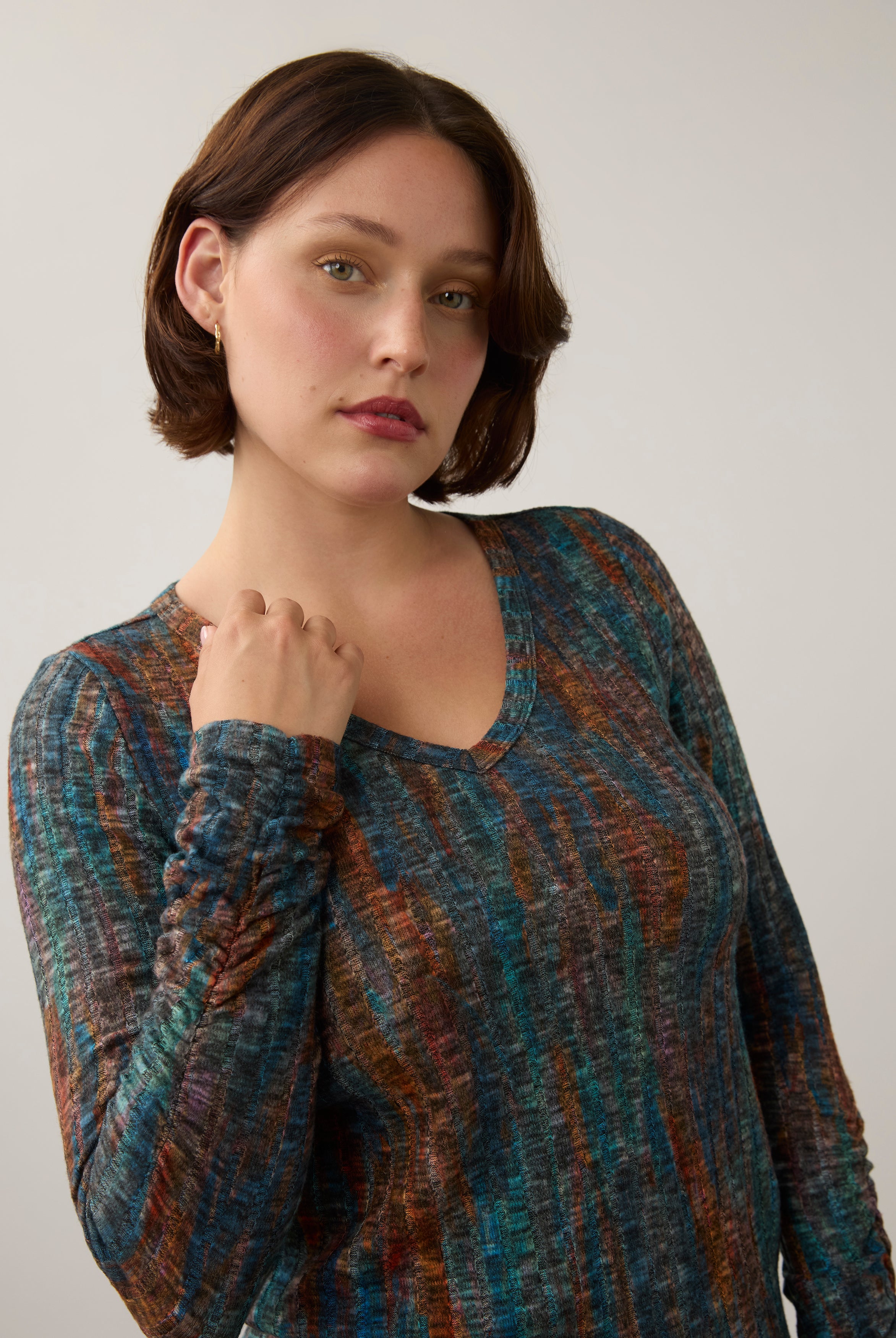 Close-up of striped V-neck top, showcasing detailed pattern and neckline by French Dressing Jeans (FDJ)