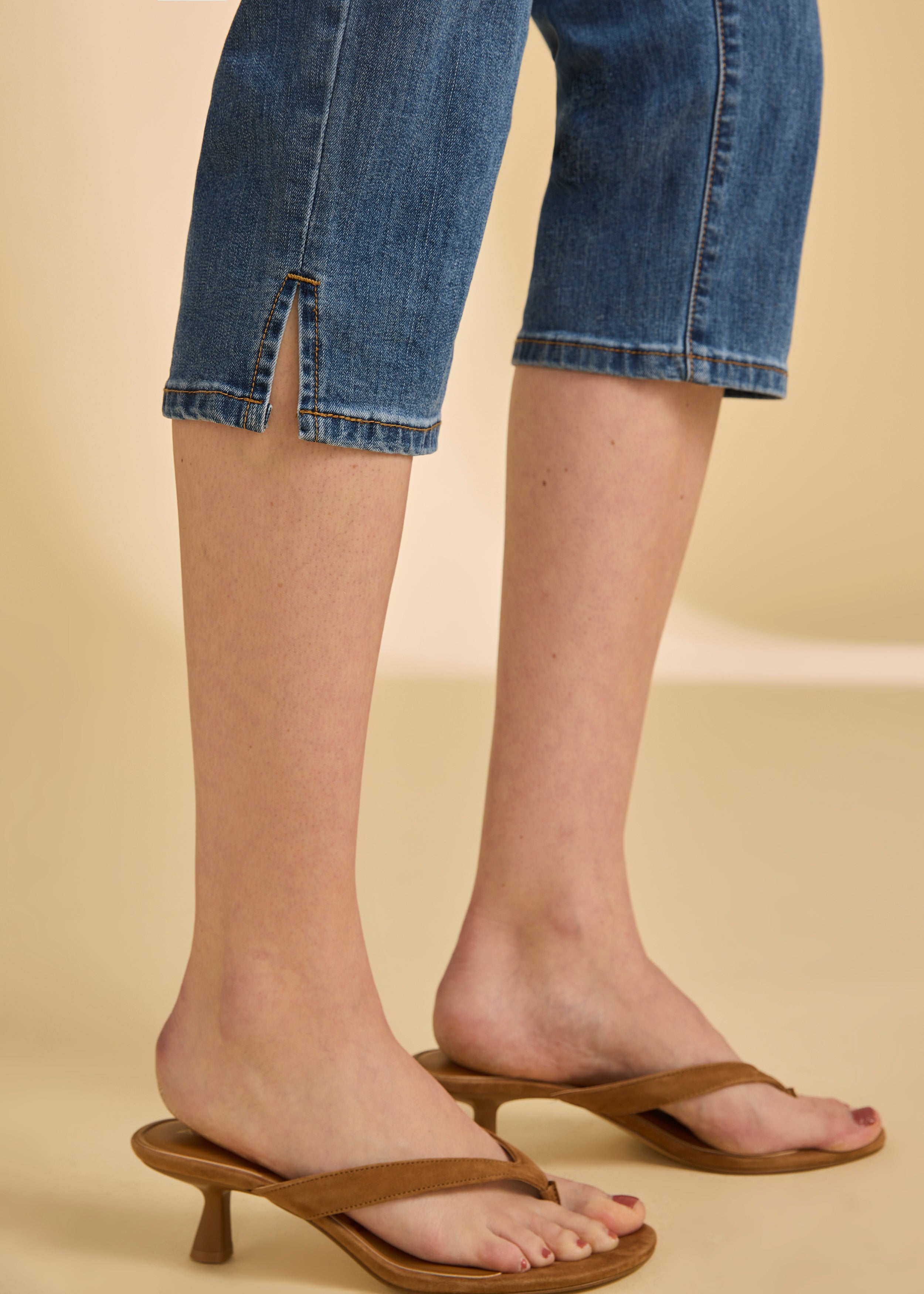 Close-up of darker indigo blue cropped jeans showing slit detail by French Dressing Jeans (FDJ)