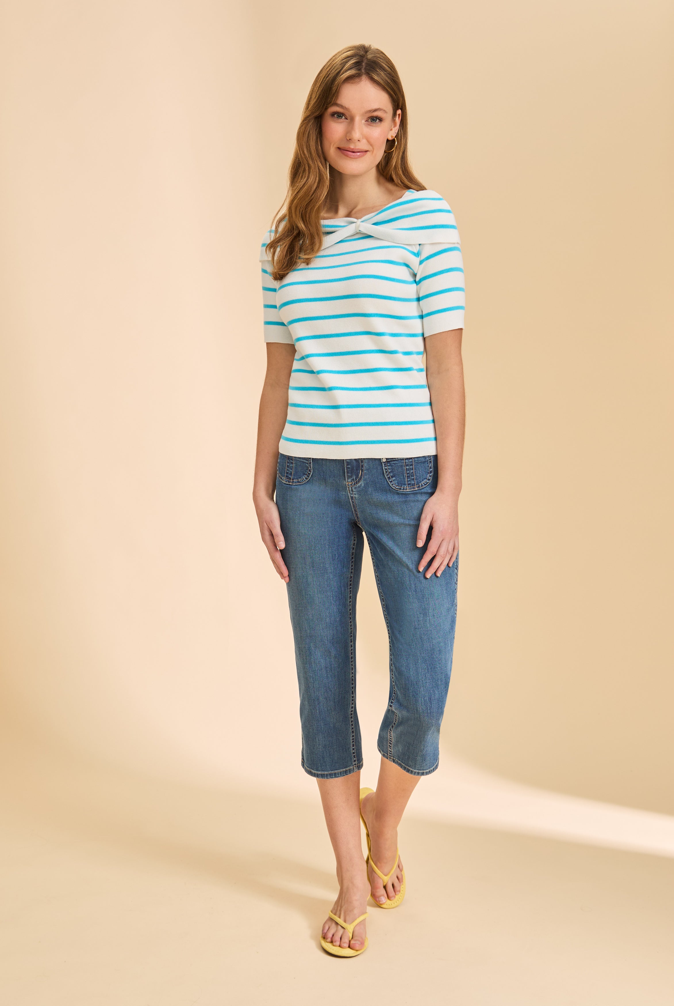 Full view of black and white striped sweater paired with capri jeans by French Dressing Jeans (FDJ)