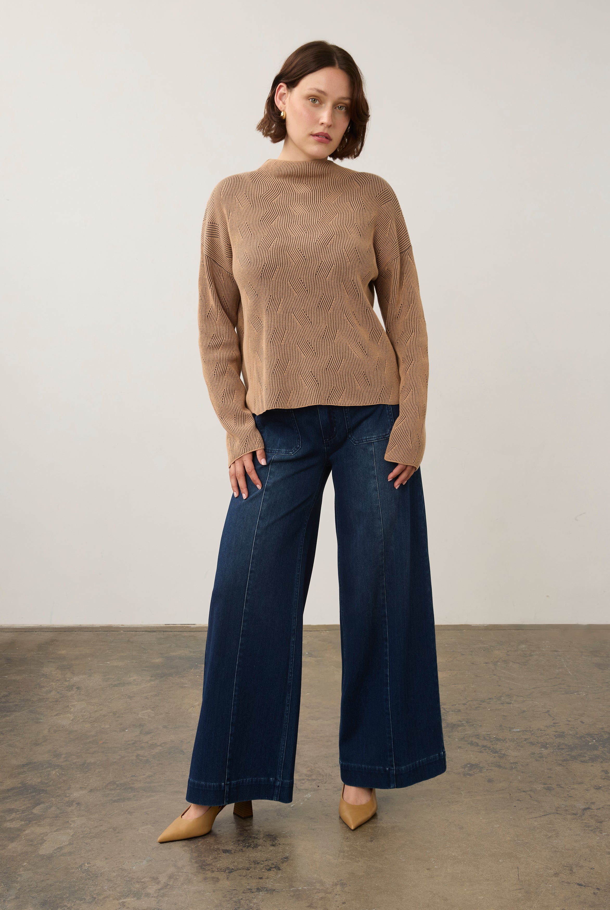 Model in tan textured top paired with wide-leg pants, full outfit view by French Dressing Jeans (FDJ)
