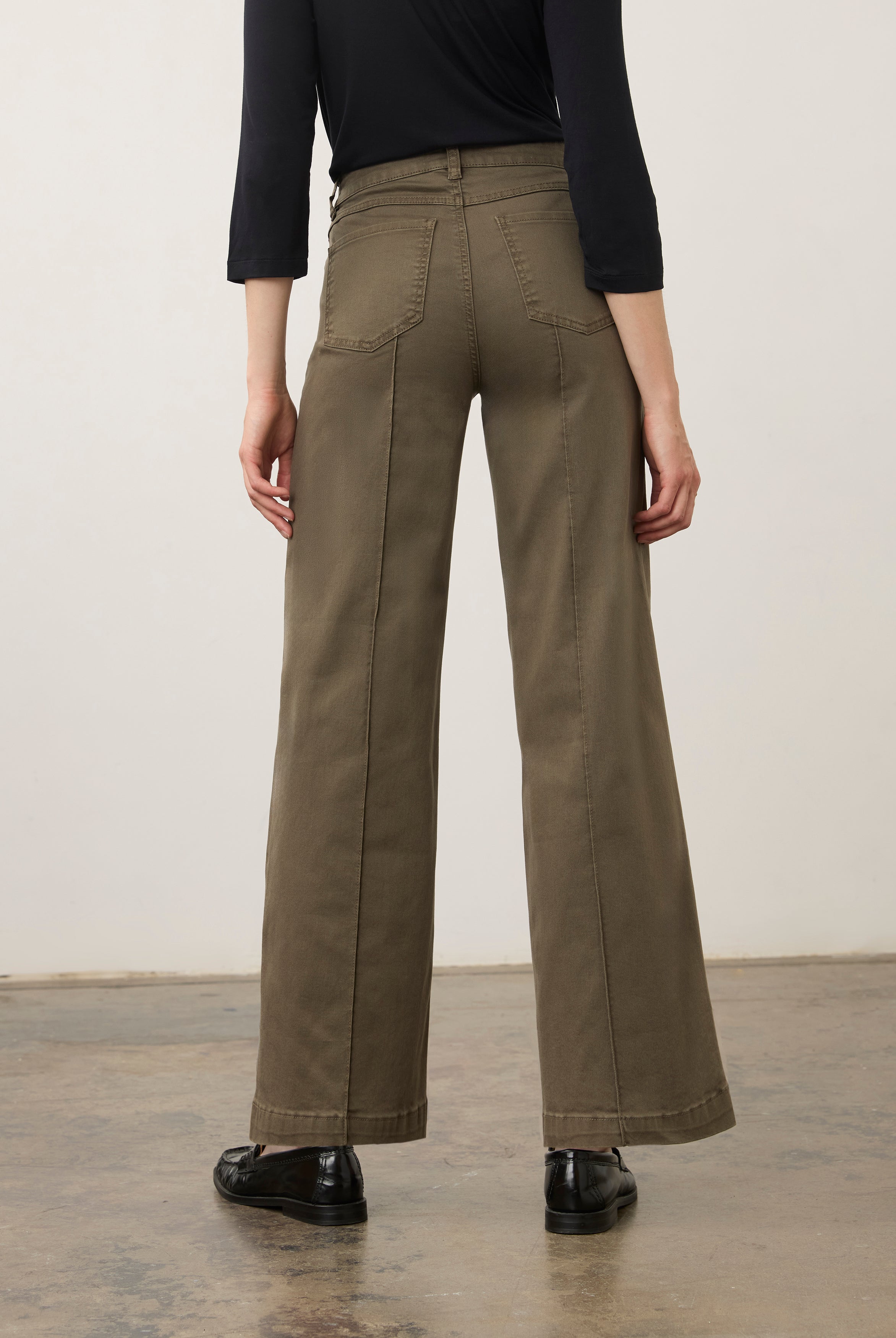 Back view of olive wide-leg denim showcasing patch pockets by French Dressing Jeans (FDJ) par French Dressing Jeans (FDJ)