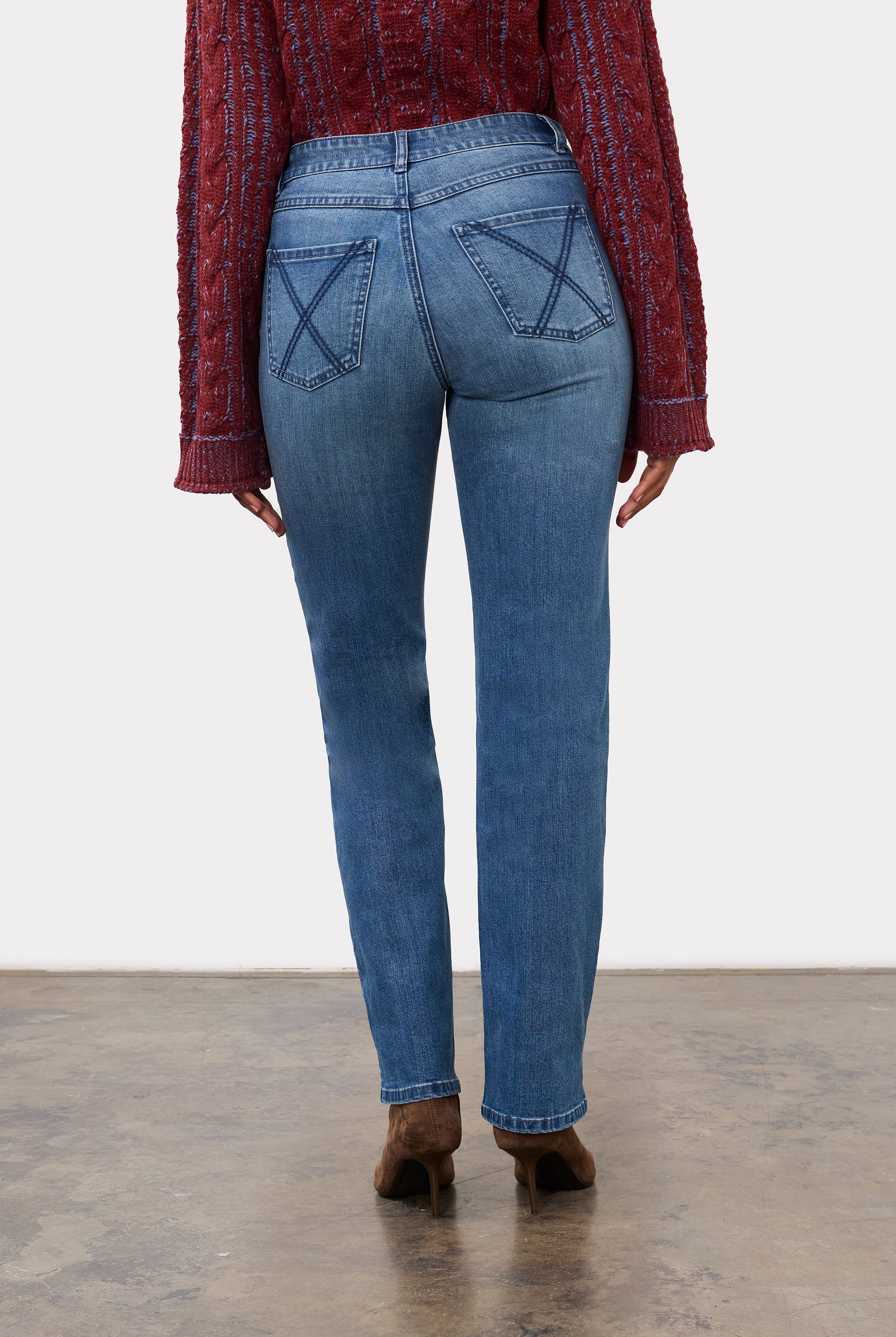 Back view of indigo jeans highlighting patch pockets and mid-rise waist by French Dressing Jeans (FDJ)