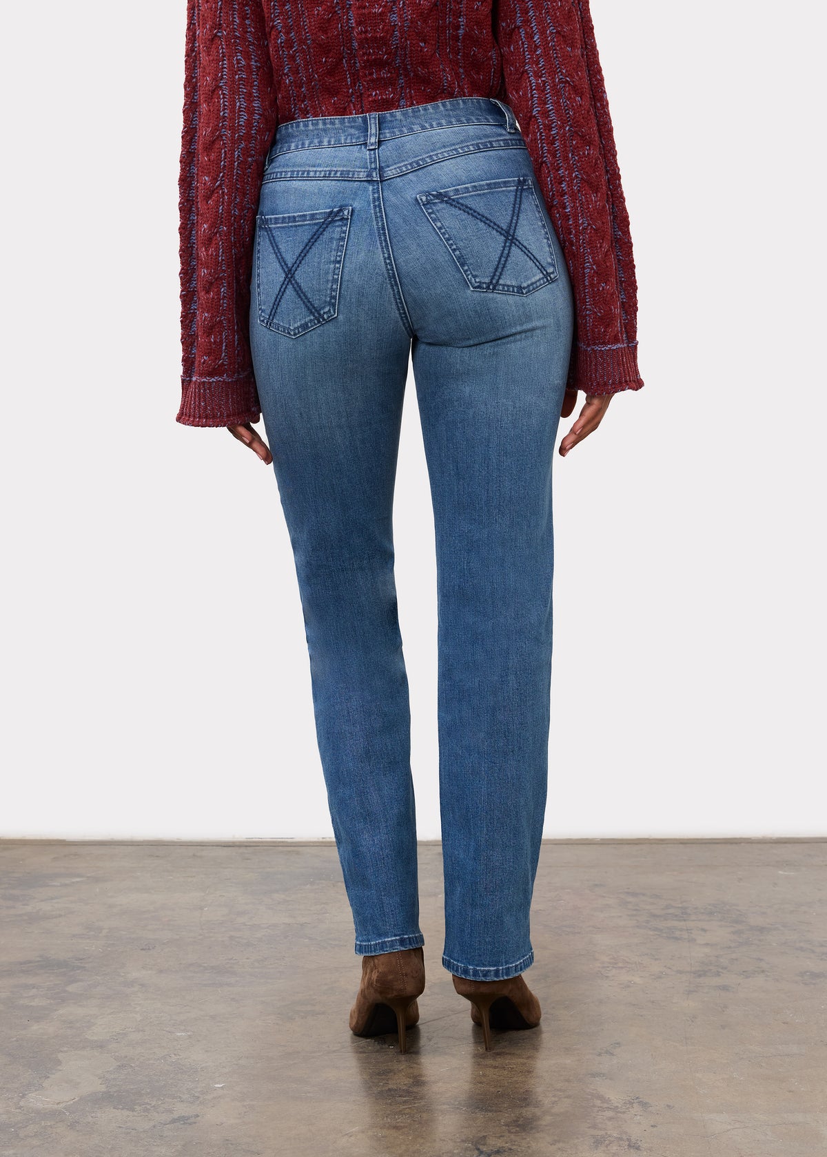 Back view of indigo jeans highlighting patch pockets and mid-rise waist by French Dressing Jeans (FDJ)