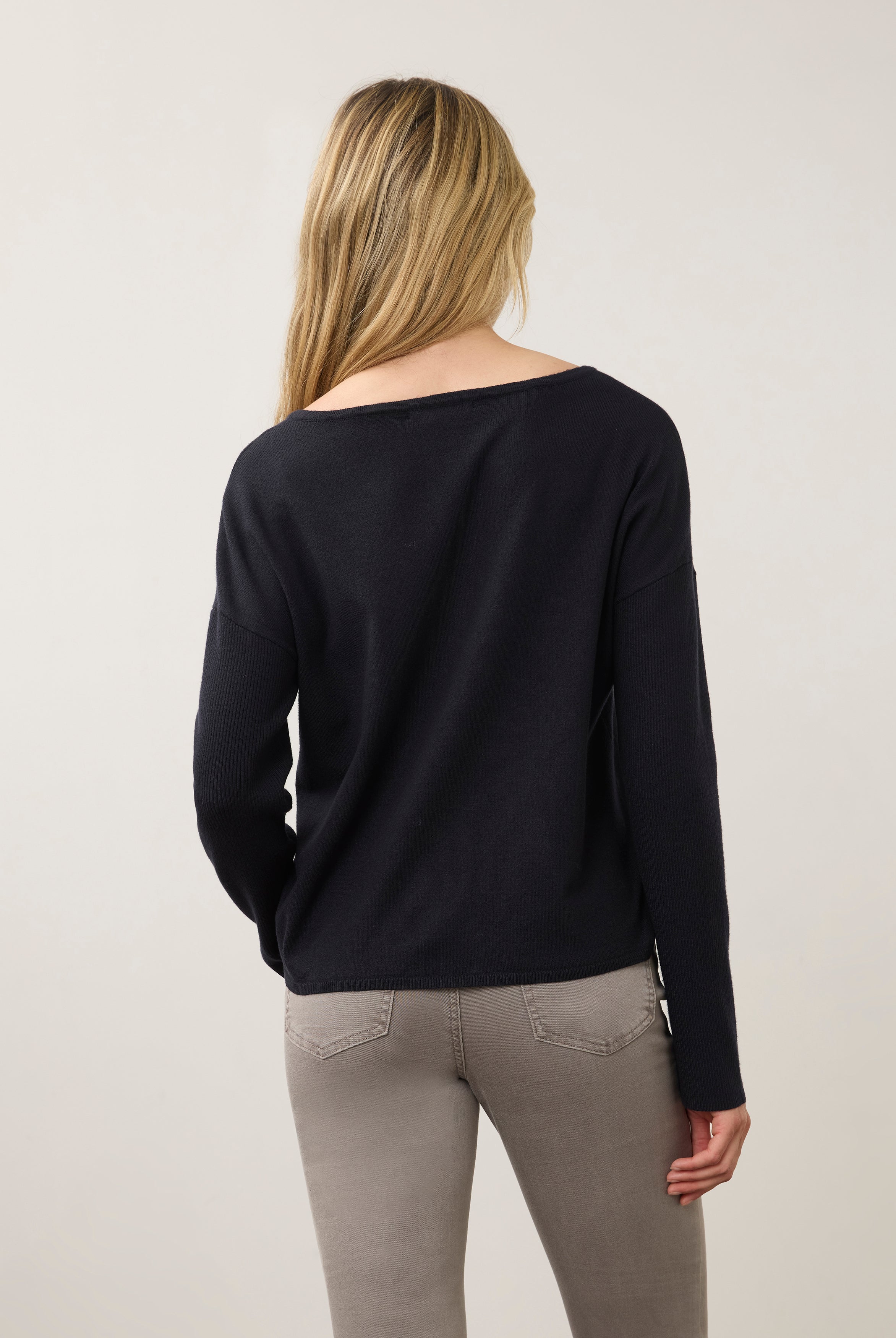 Back view of navy sweater showing simple, sleek design by French Dressing Jeans (FDJ)