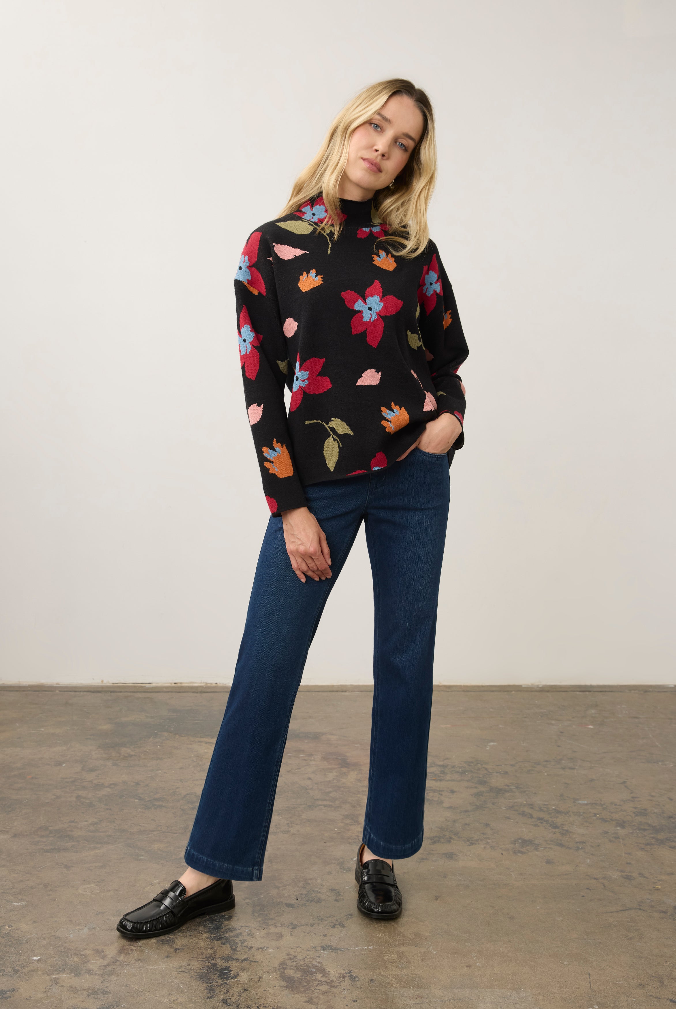 Model in black floral sweater with blue jeans, full outfit view by French Dressing Jeans (FDJ)