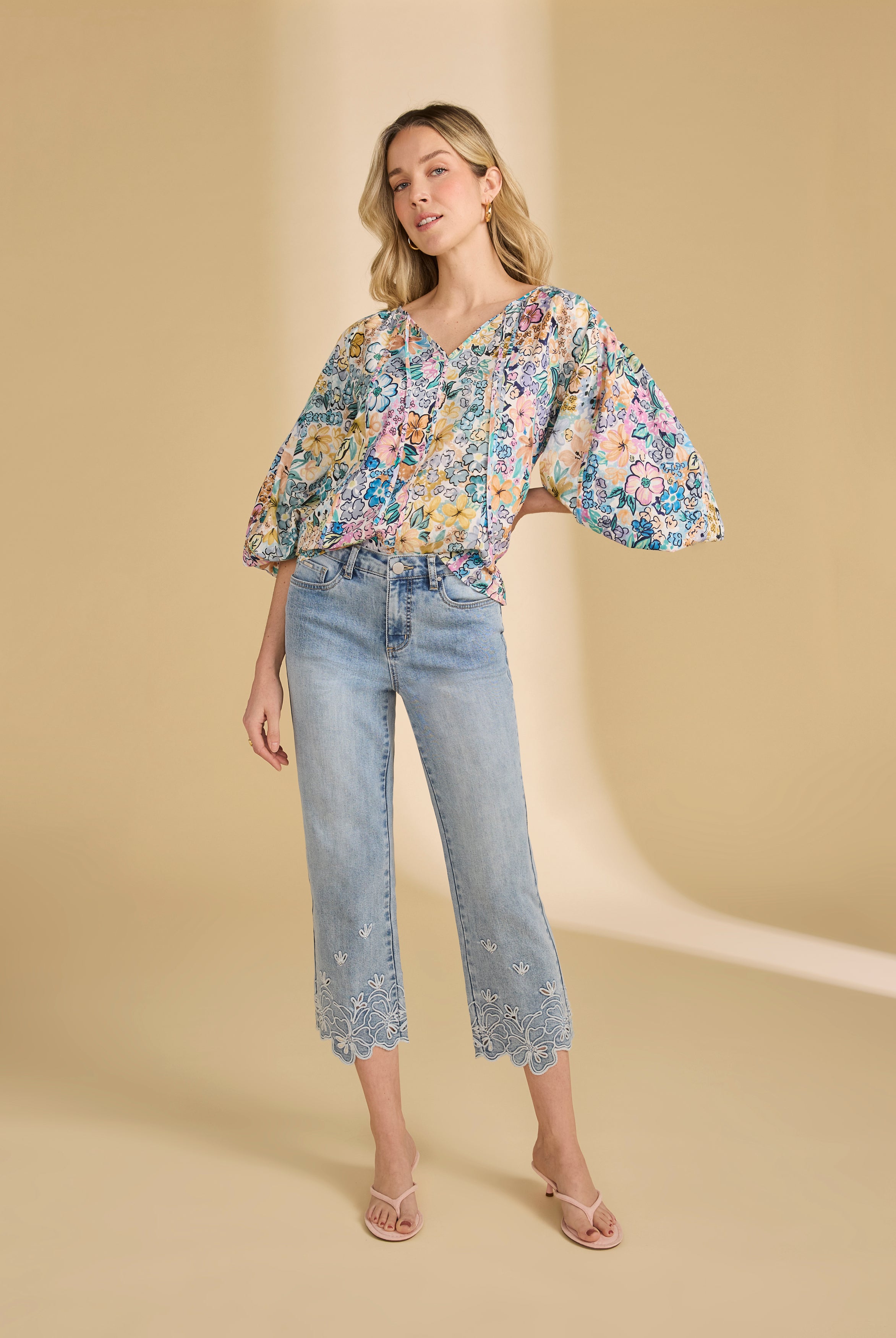 Model in floral embroidered ocean denim jeans with relaxed style by French Dressing Jeans (FDJ)