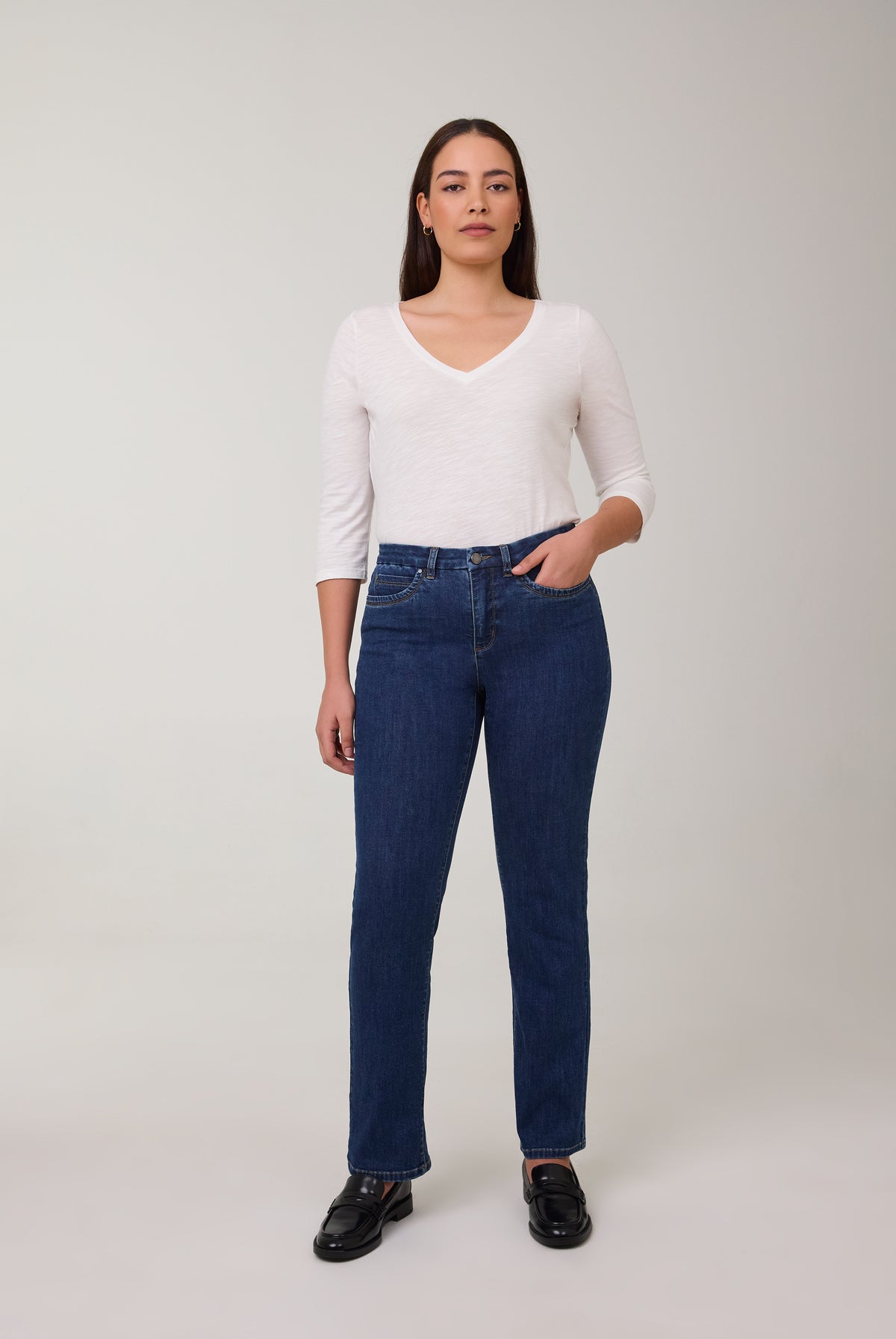 Model in tapered straight leg jeans in Delight color by French Dressing Jeans (FDJ)