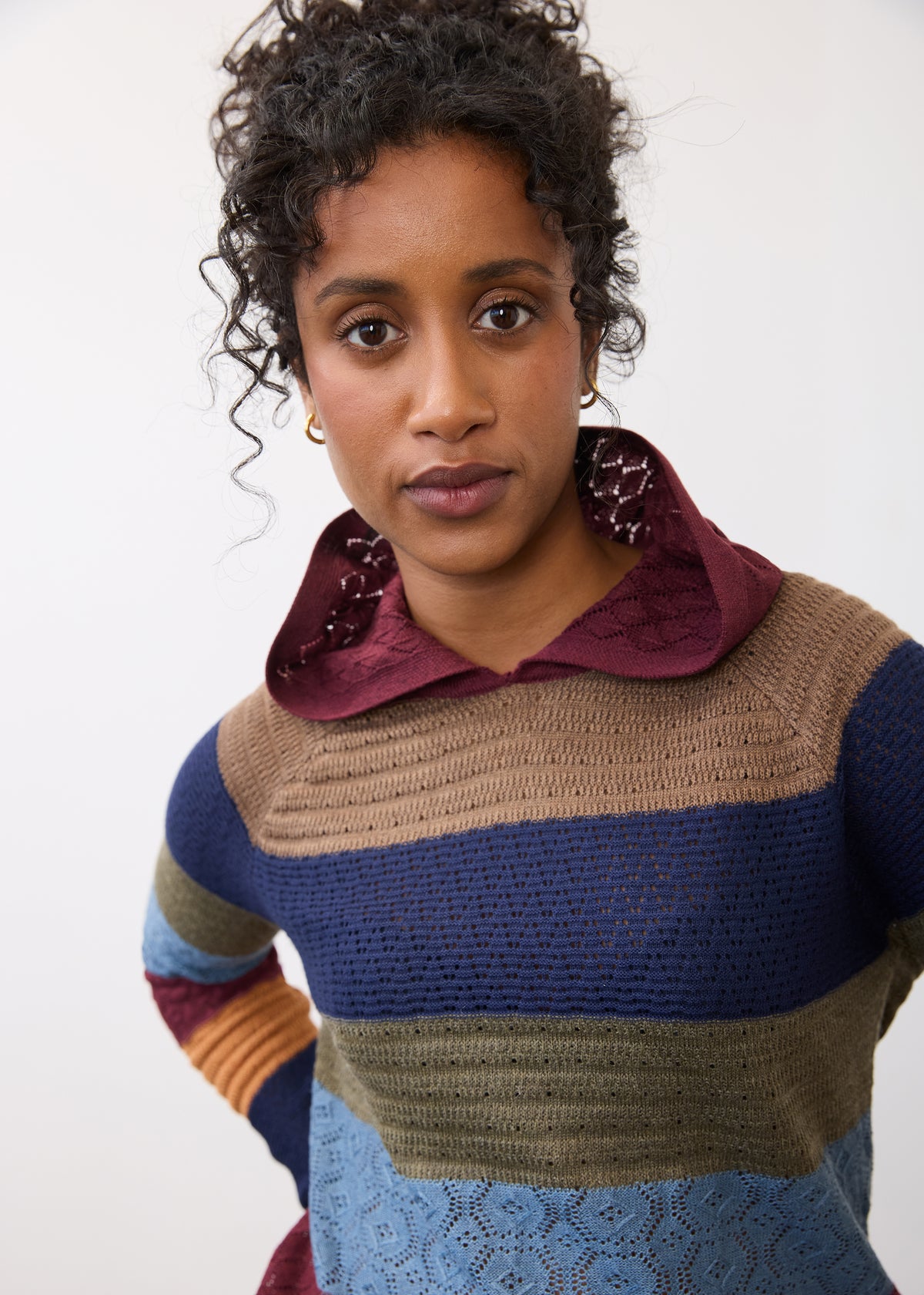 Close-up of multicolored hoodie sweater highlighting knit pattern and hood detail by French Dressing Jeans (FDJ)