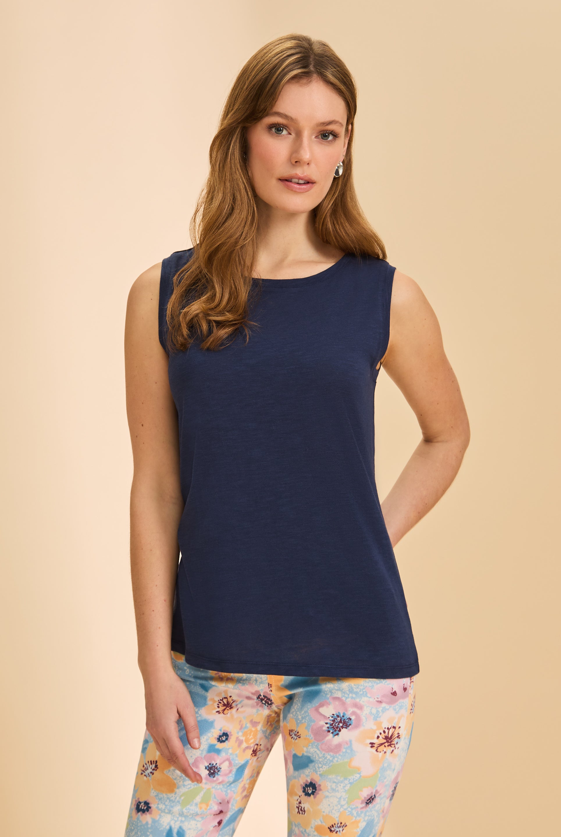 Front view of navy sleeveless top paired with colorful floral pants for a bold look by French Dressing Jeans (FDJ)