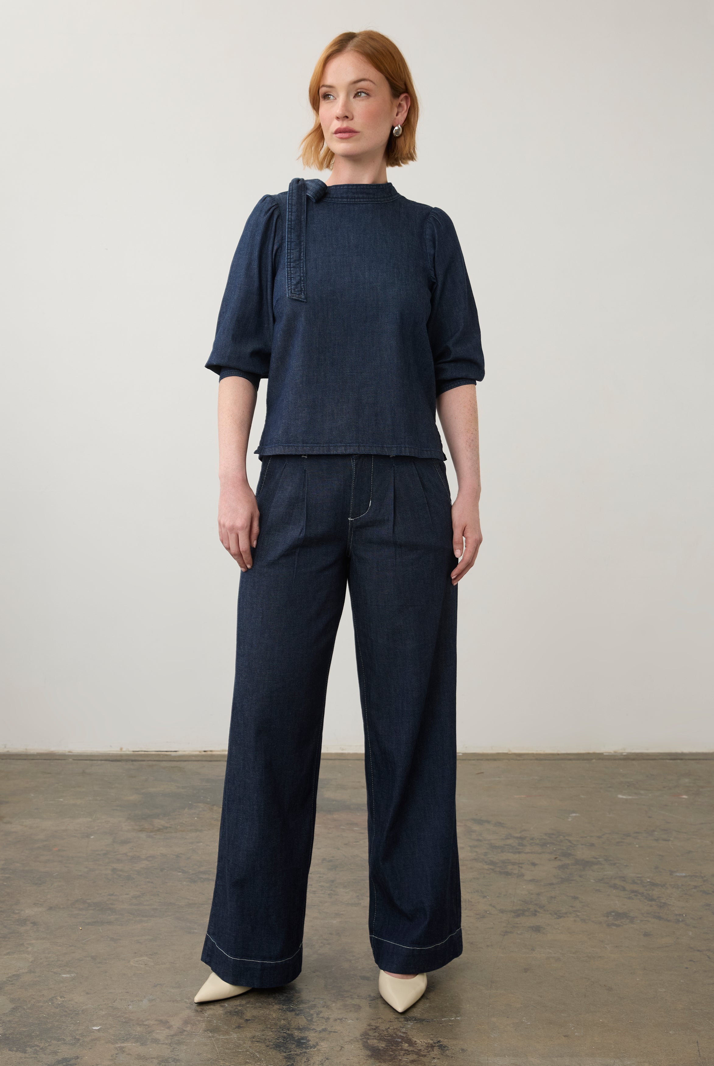 Full view of dark wash denim set with wide-leg pants and a puff-sleeve top by French Dressing Jeans (FDJ)