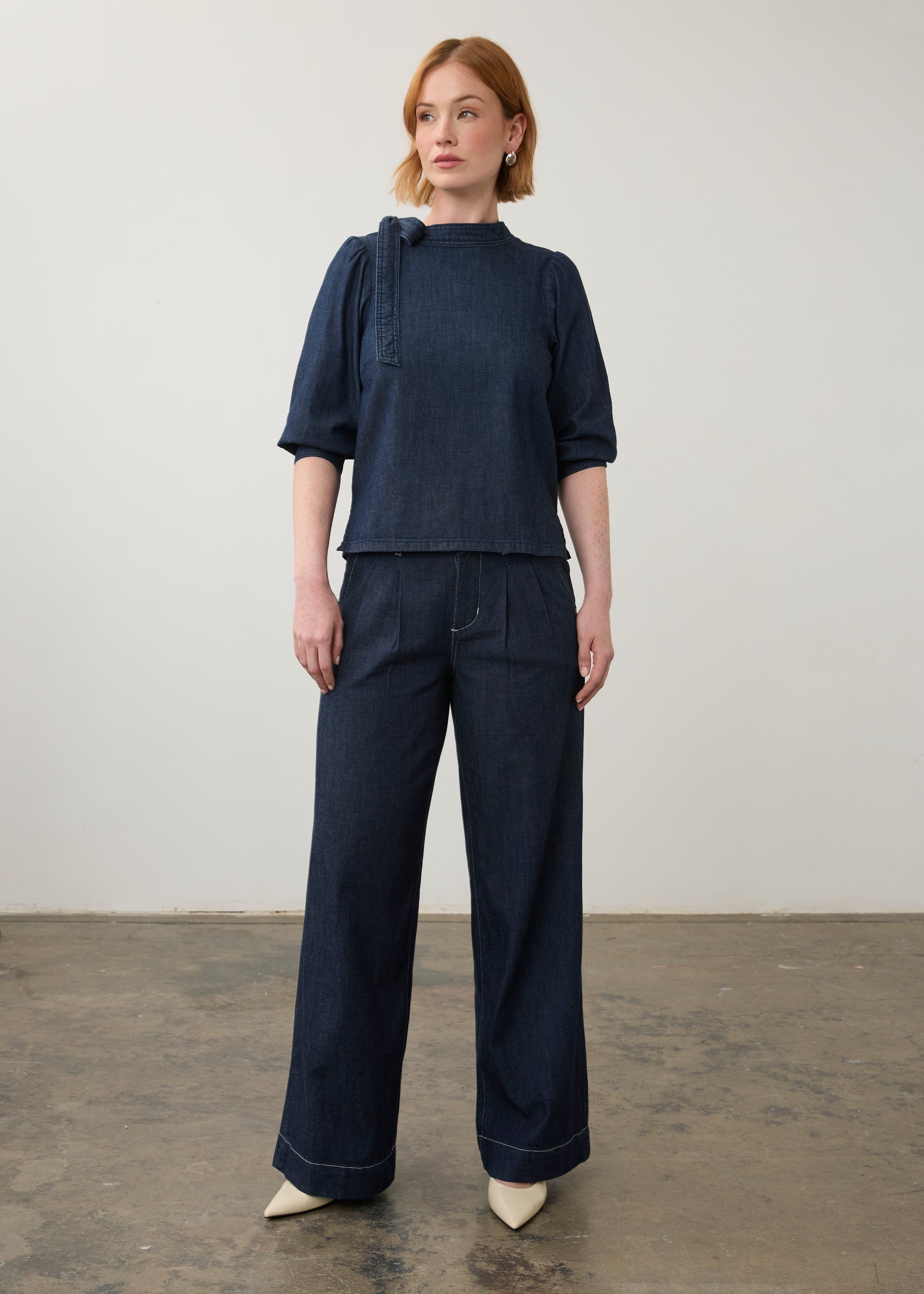 Full view of dark wash denim set with wide-leg pants and a puff-sleeve top by French Dressing Jeans (FDJ)