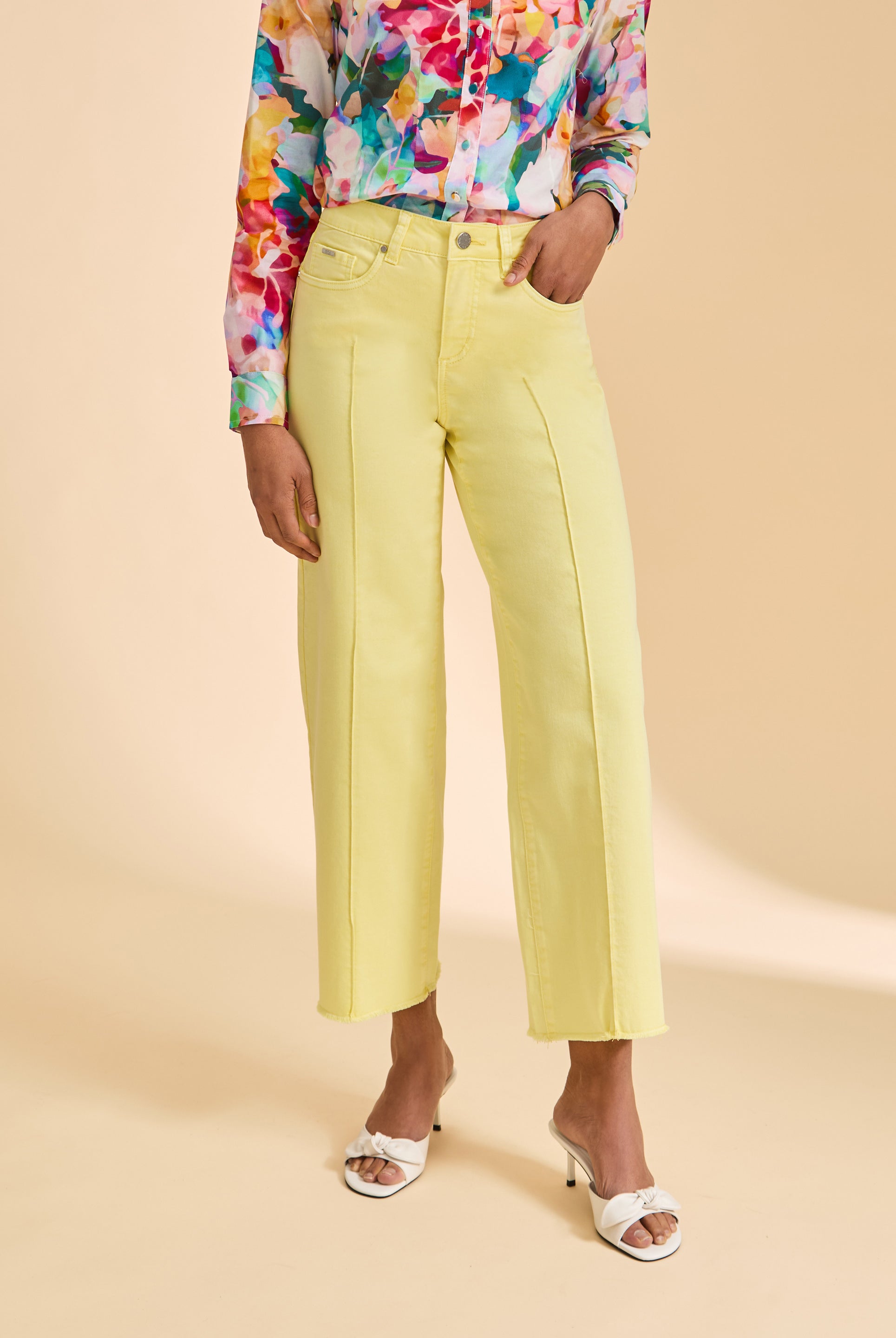 Close-up of yellow wide-leg pants with front pockets by French Dressing Jeans (FDJ)