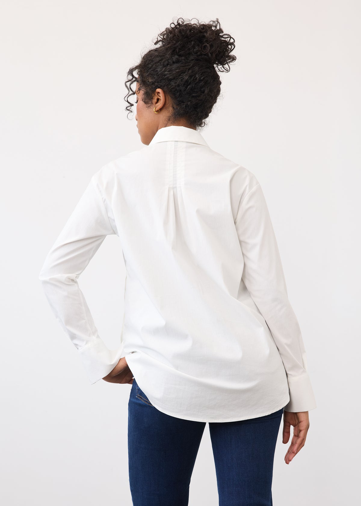Back view of white shirt featuring a pleated yoke and long sleeves by French Dressing Jeans (FDJ)