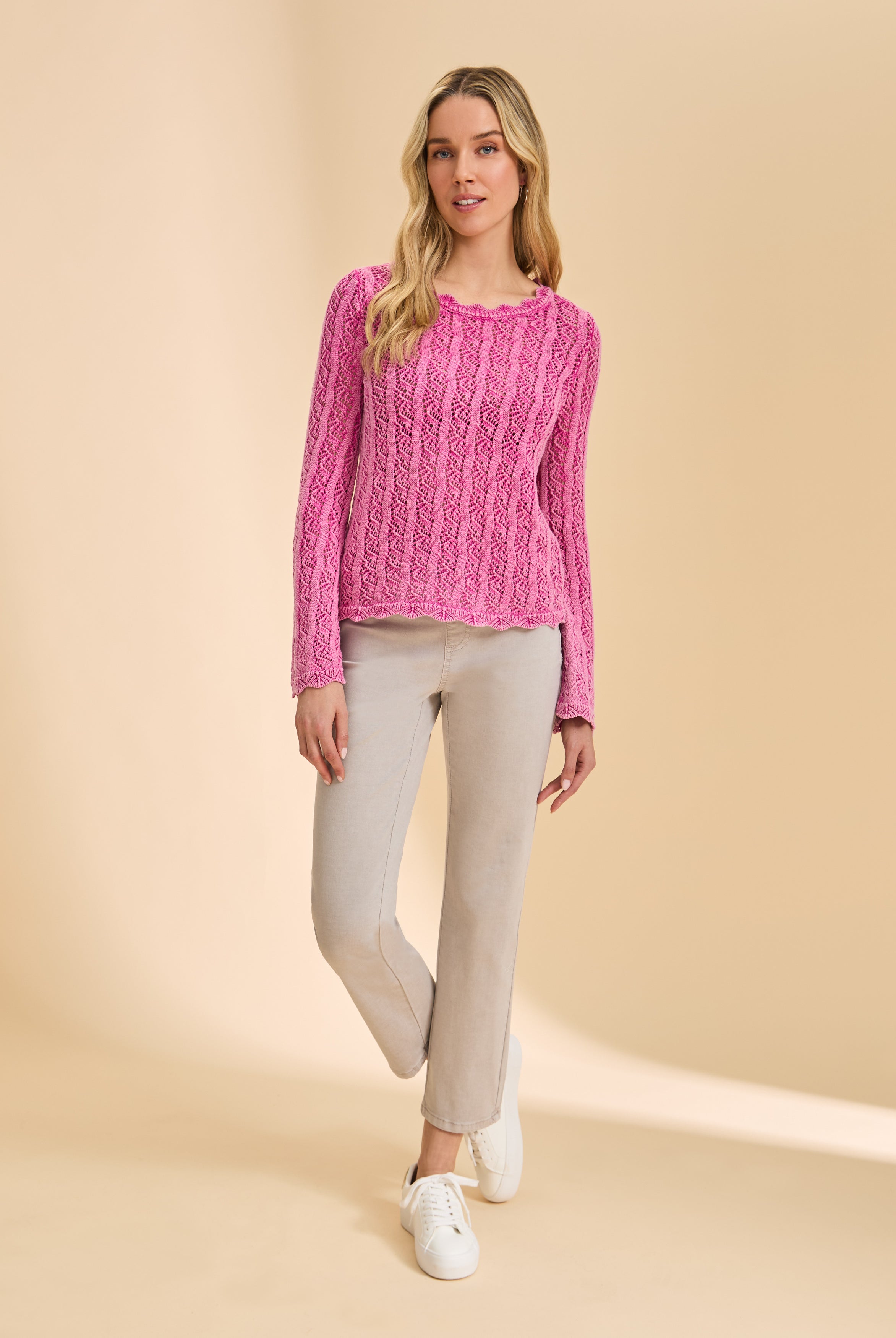 Front view of taupe straight-leg jeans, paired with pink sweater by French Dressing Jeans (FDJ)