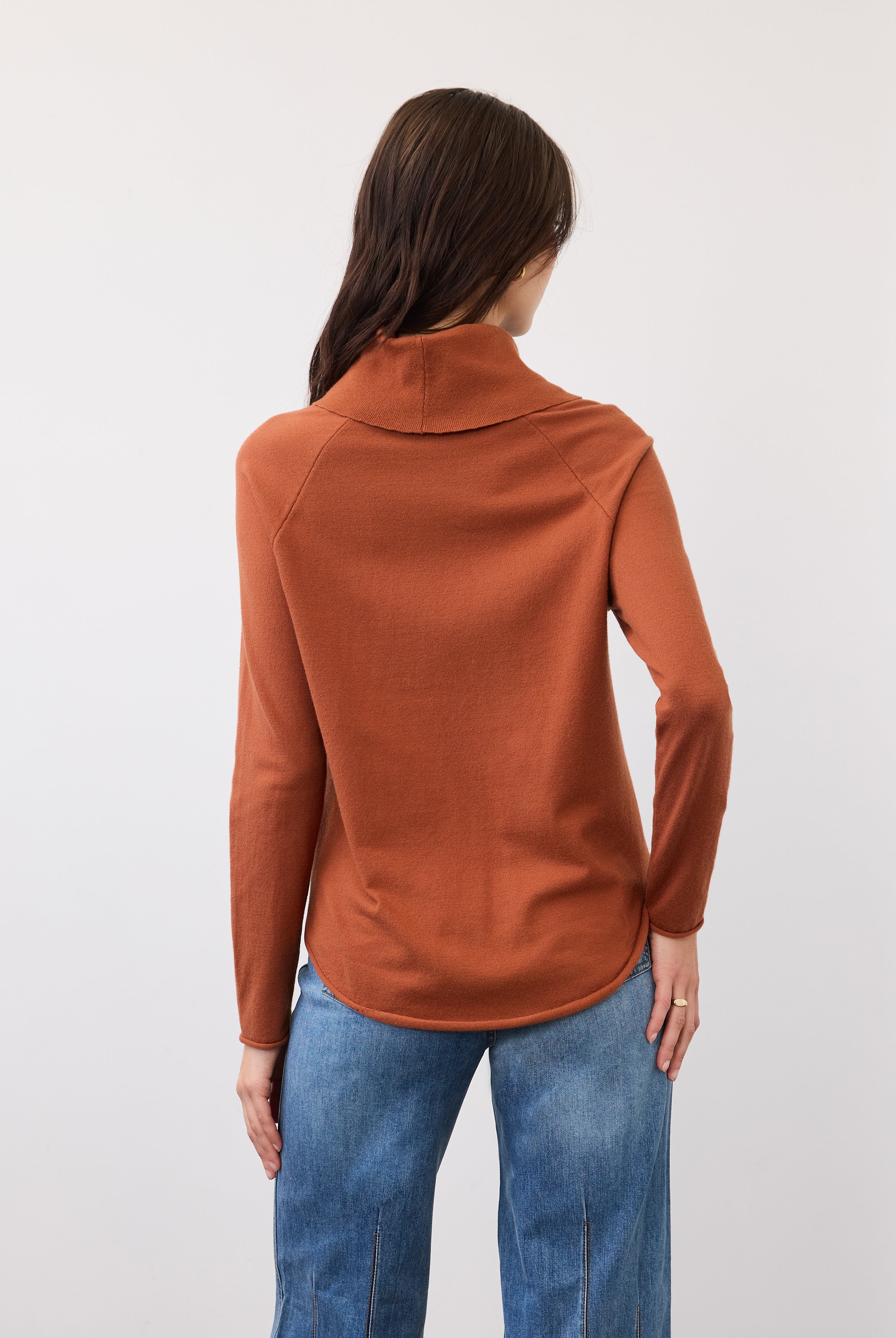 Back view of rust sweater with seamless shoulder design by French Dressing Jeans (FDJ)