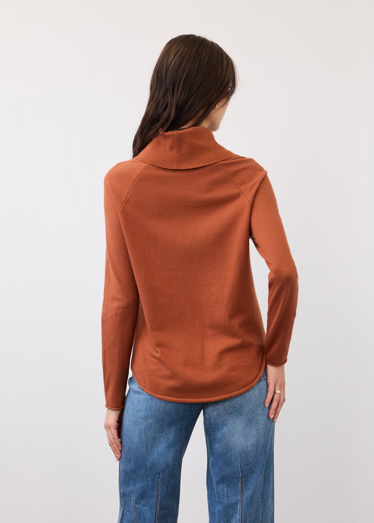 Back view of rust sweater with seamless shoulder design by French Dressing Jeans (FDJ)