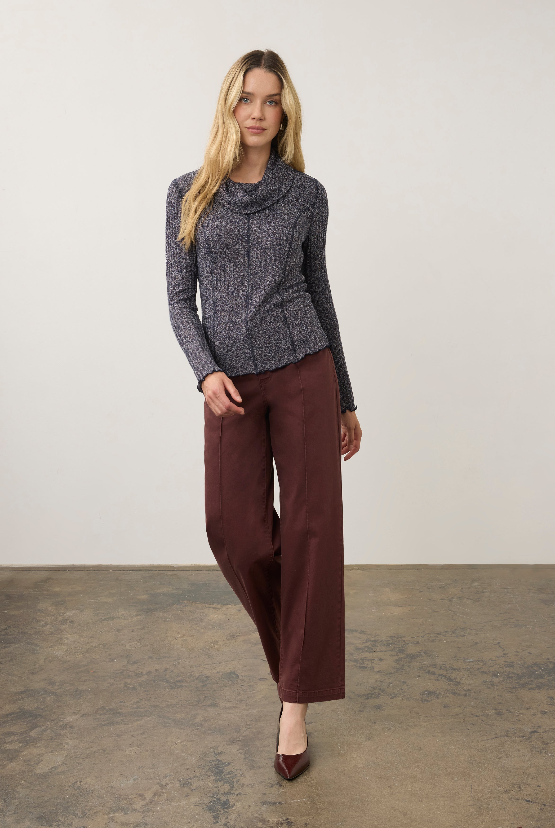 Full body view of blue cowl neck top paired with maroon pants by French Dressing Jeans (FDJ)