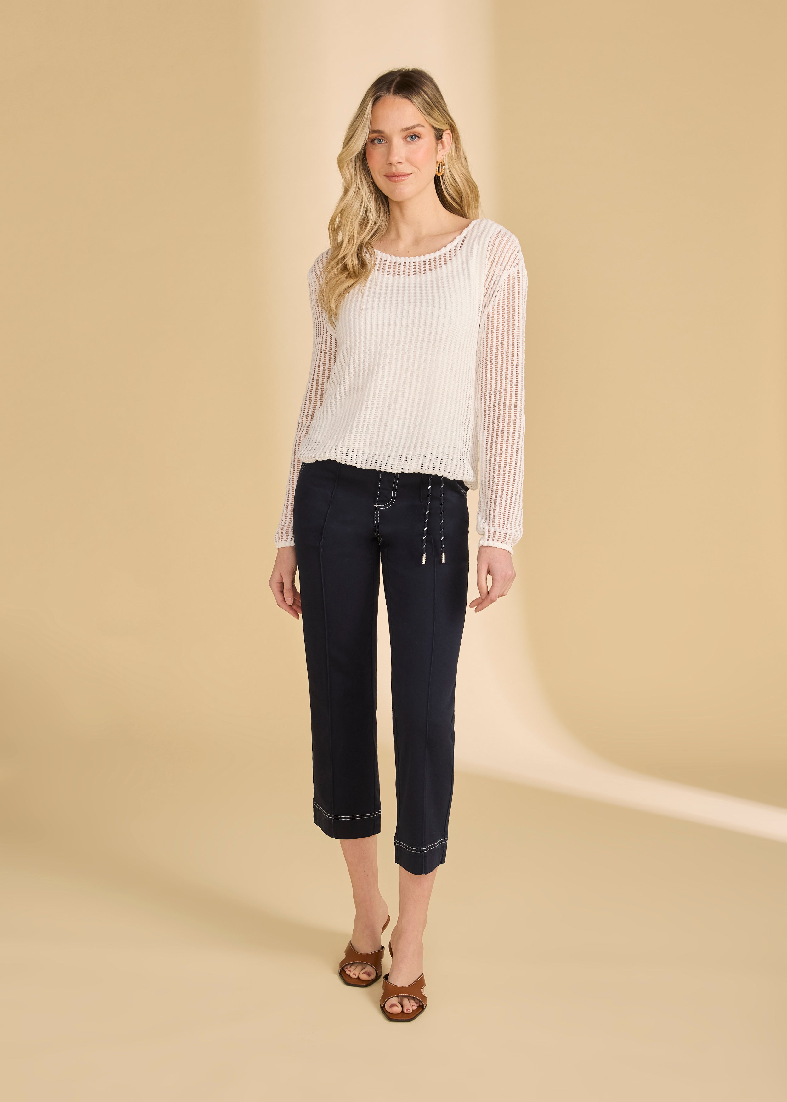 Full view of white mesh top paired with navy cropped pants and heels by French Dressing Jeans (FDJ)