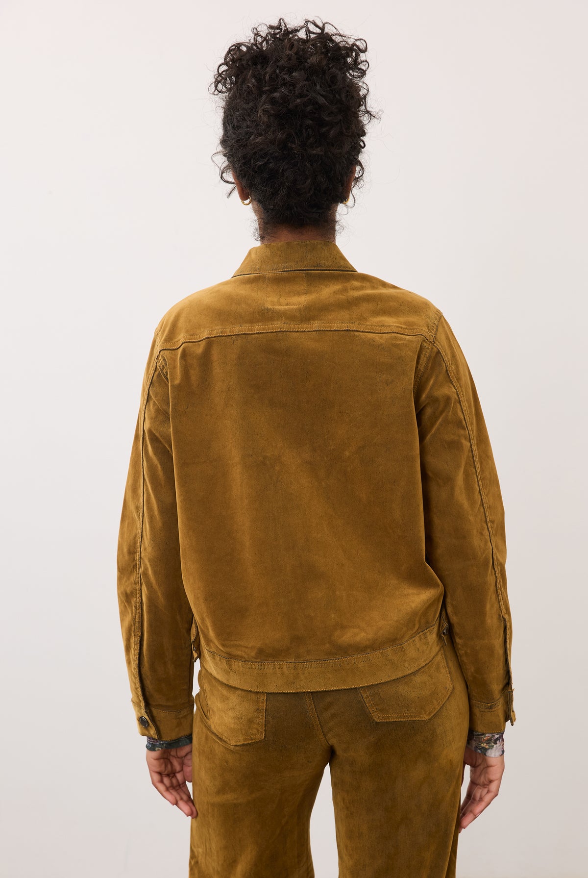 Back view of brass Olivia jacket showing seamless shoulder design by French Dressing Jeans (FDJ)
