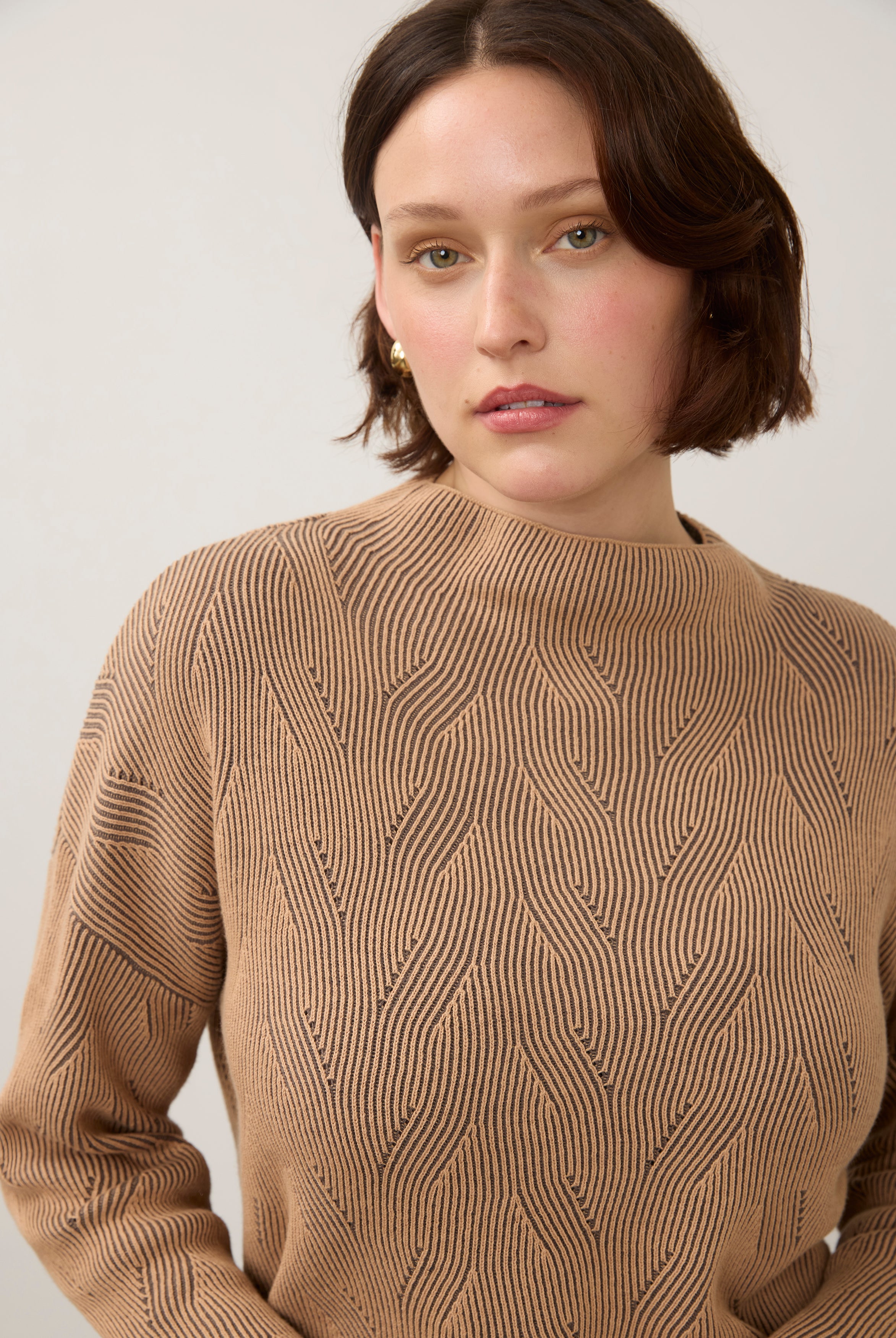 Close-up of tan textured top with high collar detail by French Dressing Jeans (FDJ)