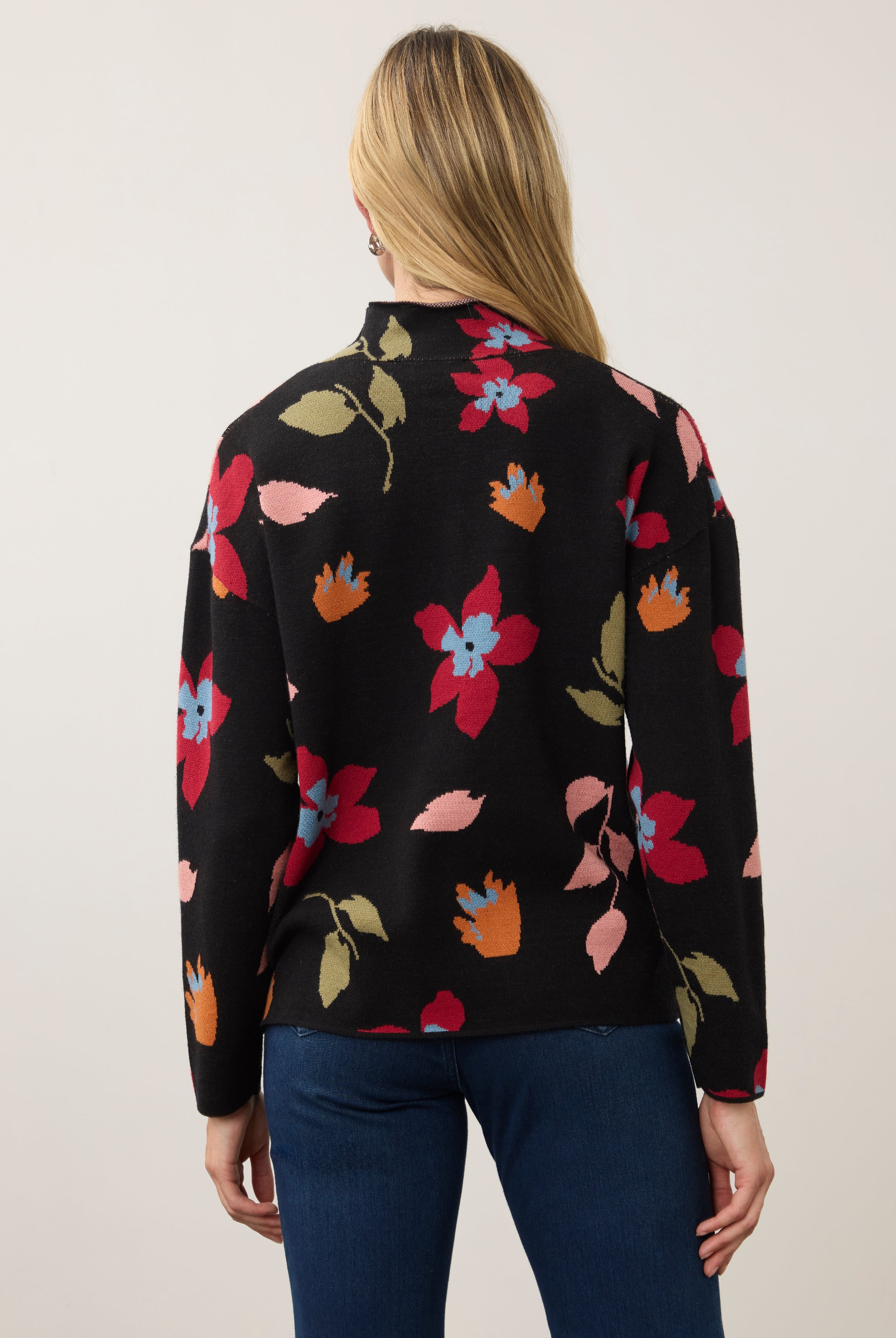 Back view of black floral sweater showing seamless design by French Dressing Jeans (FDJ)