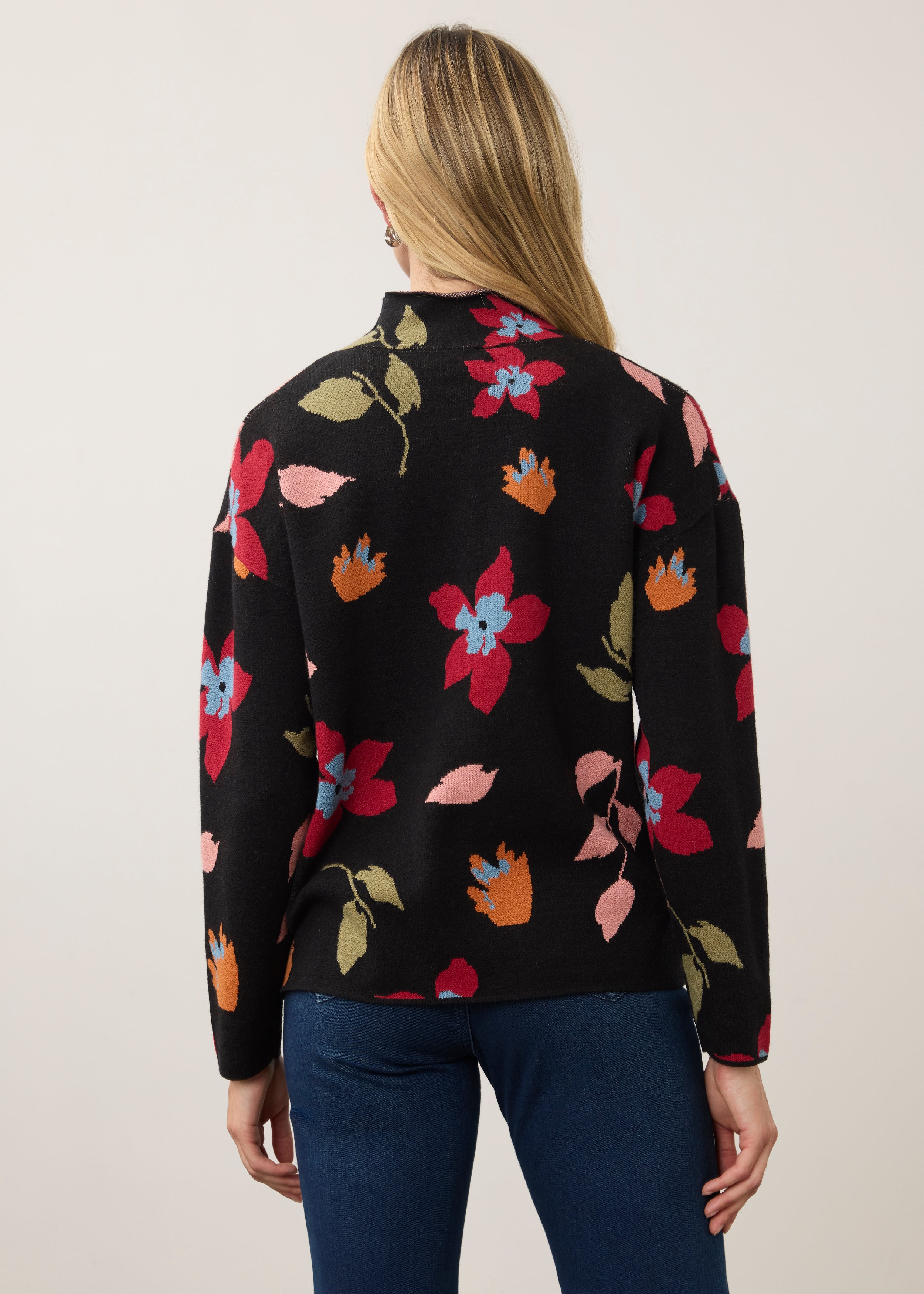 Back view of black floral sweater showing seamless design by French Dressing Jeans (FDJ)