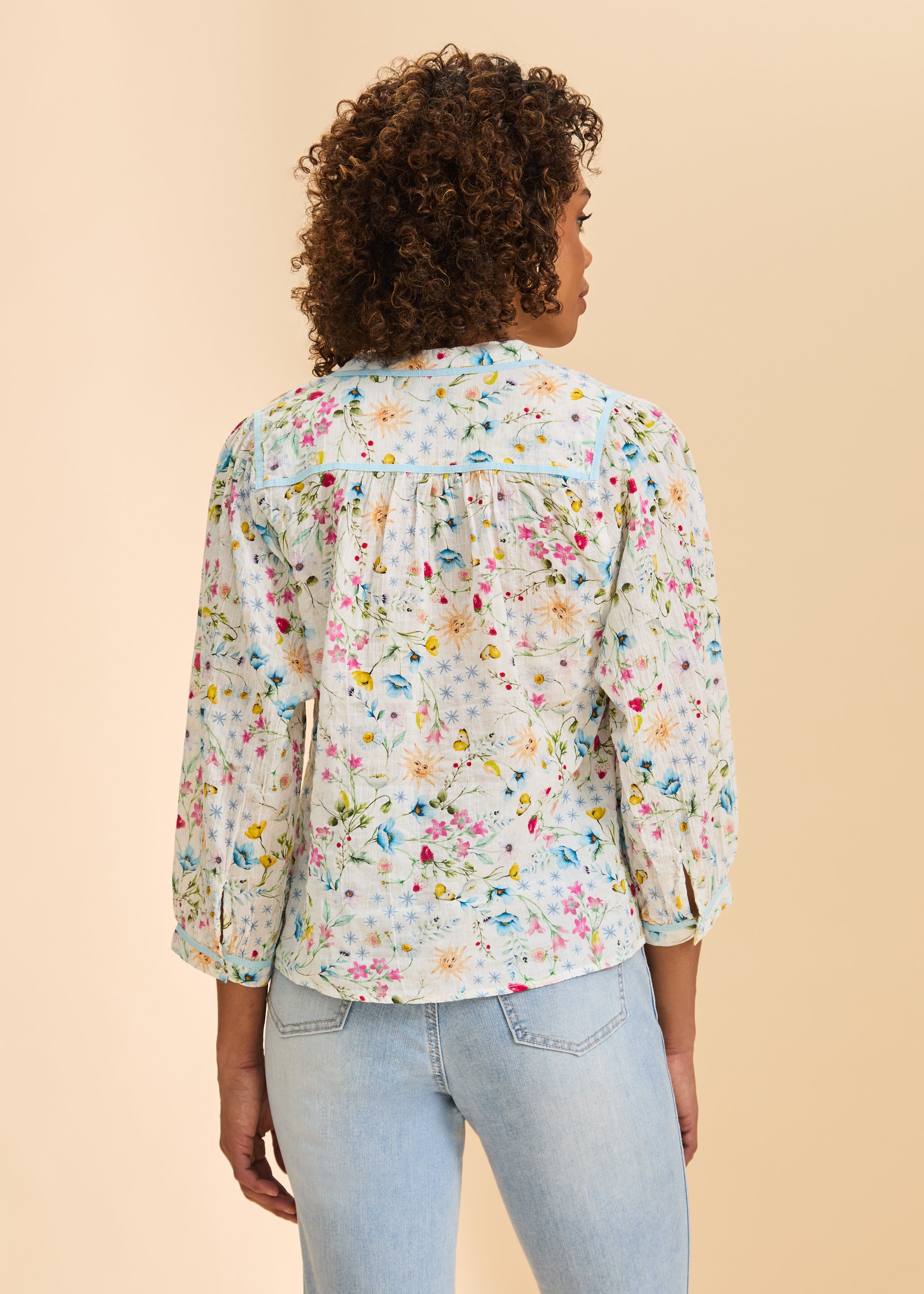 Back view of floral print blouse highlighting gathered yoke by French Dressing Jeans (FDJ)