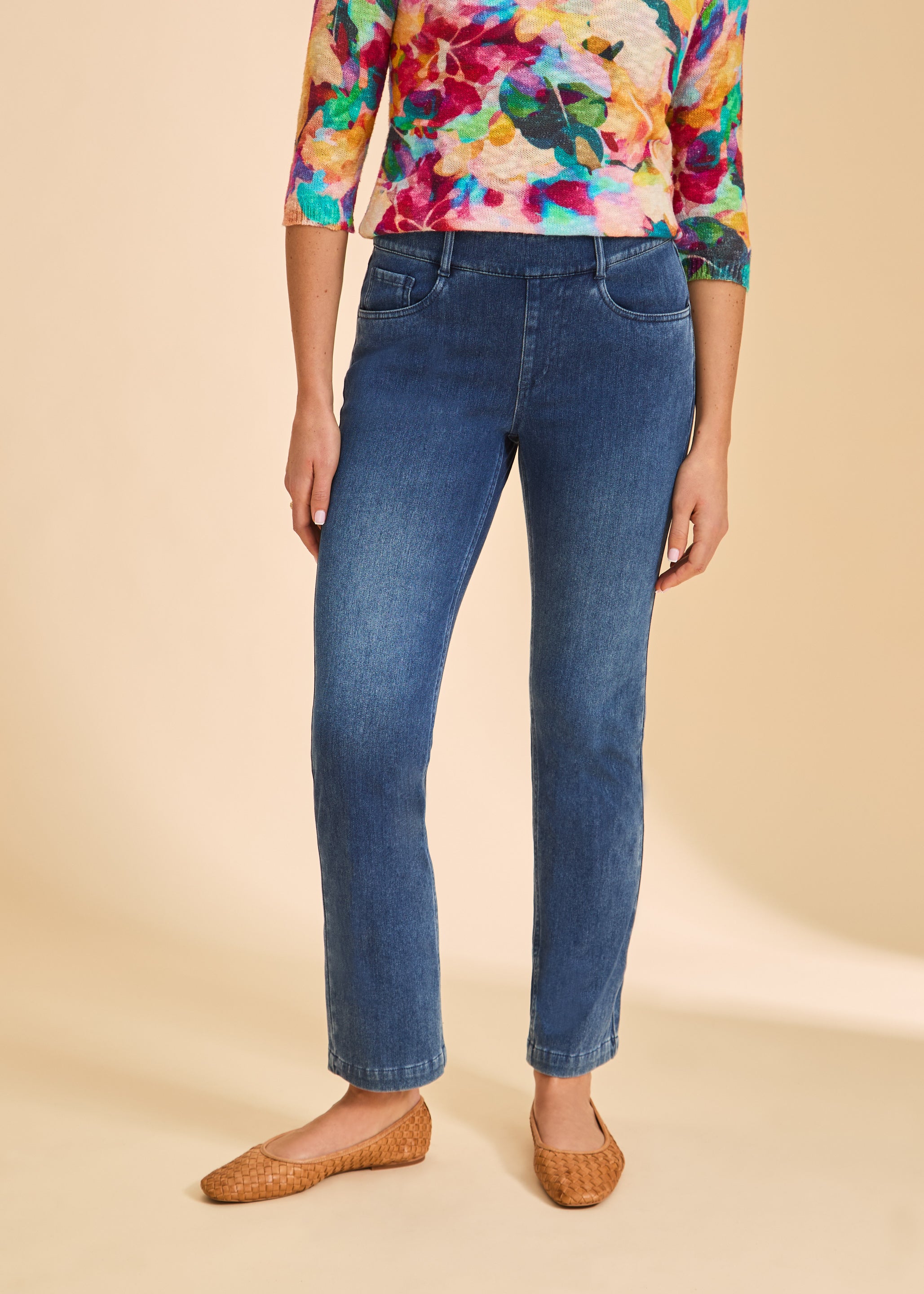 Close-up front view showing mid-rise waist of blue denim straight leg jeans by French Dressing Jeans (FDJ)